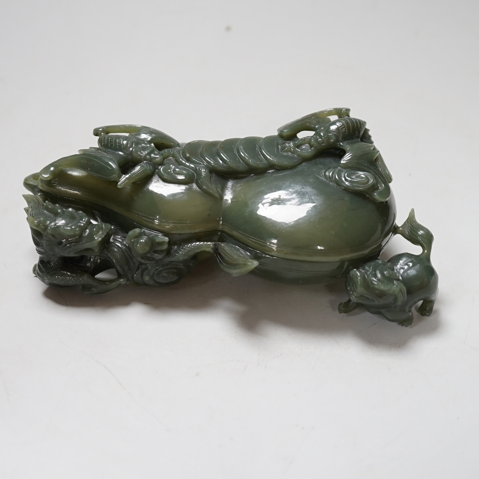 A Chinese spinach green jade double gourd shaped box and cover, 17cm                                                                                                                                                        