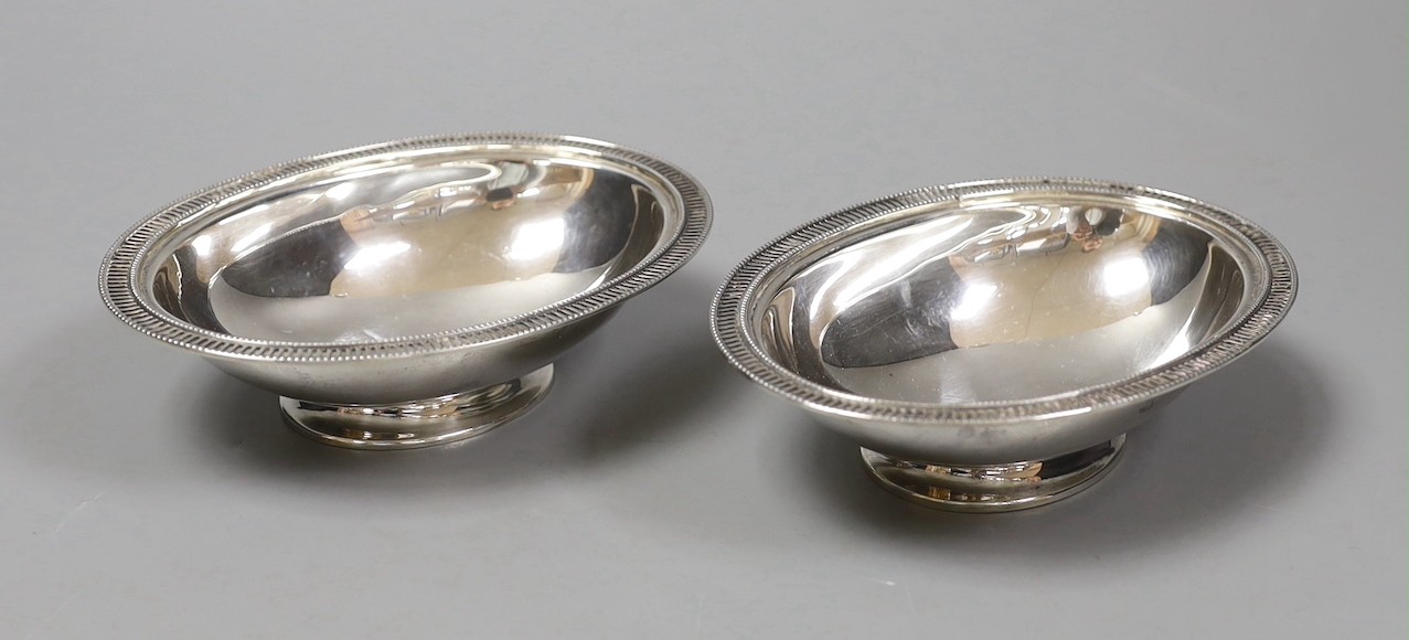 A pair of George V silver oval pedestal nut dishes, by Mappin & Webb, Birmingham, 1929, 12.7cm, 142 grams.                                                                                                                  