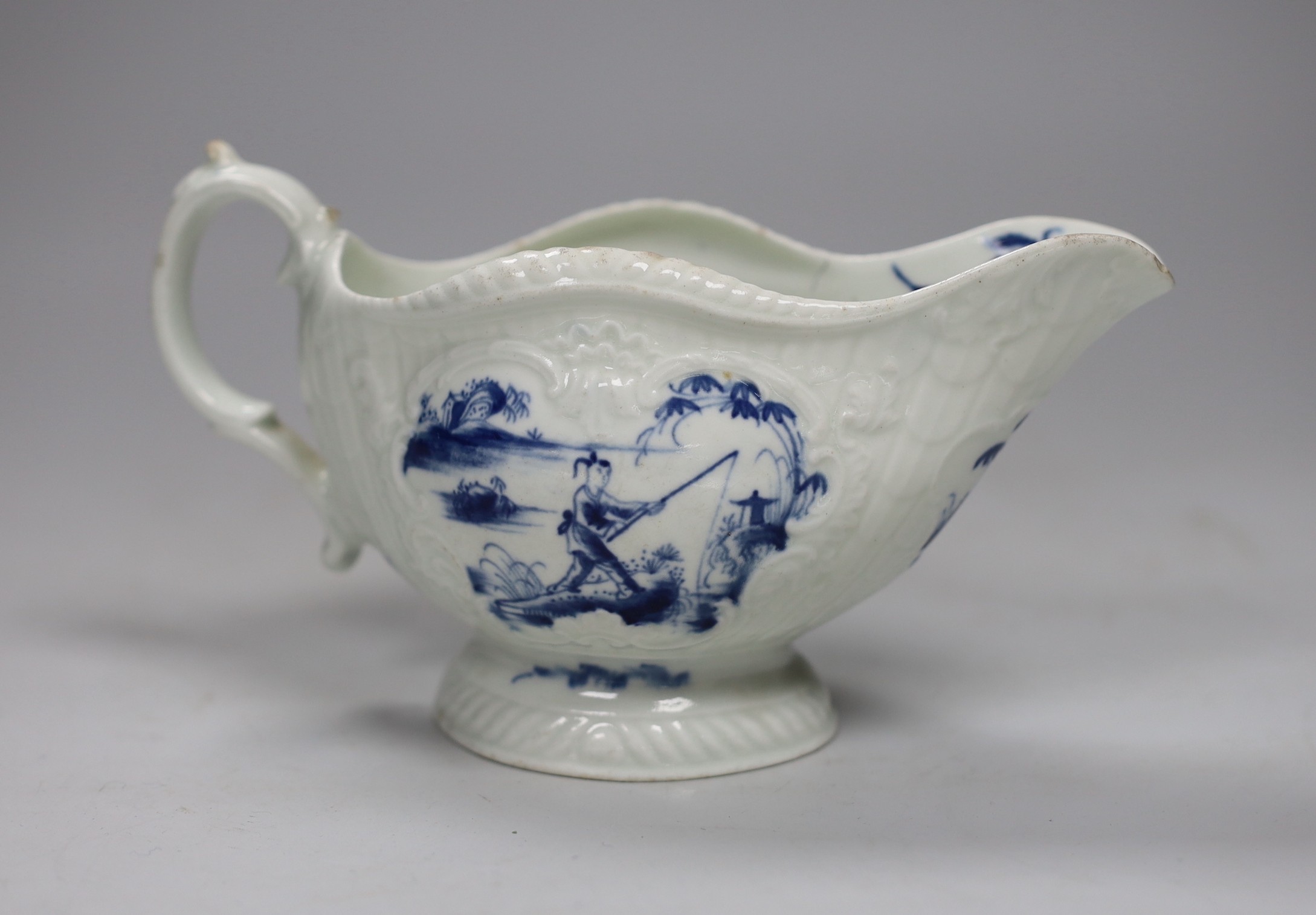 A Worcester ‘fishermen’ pattern sauce boat, 17cm long                                                                                                                                                                       