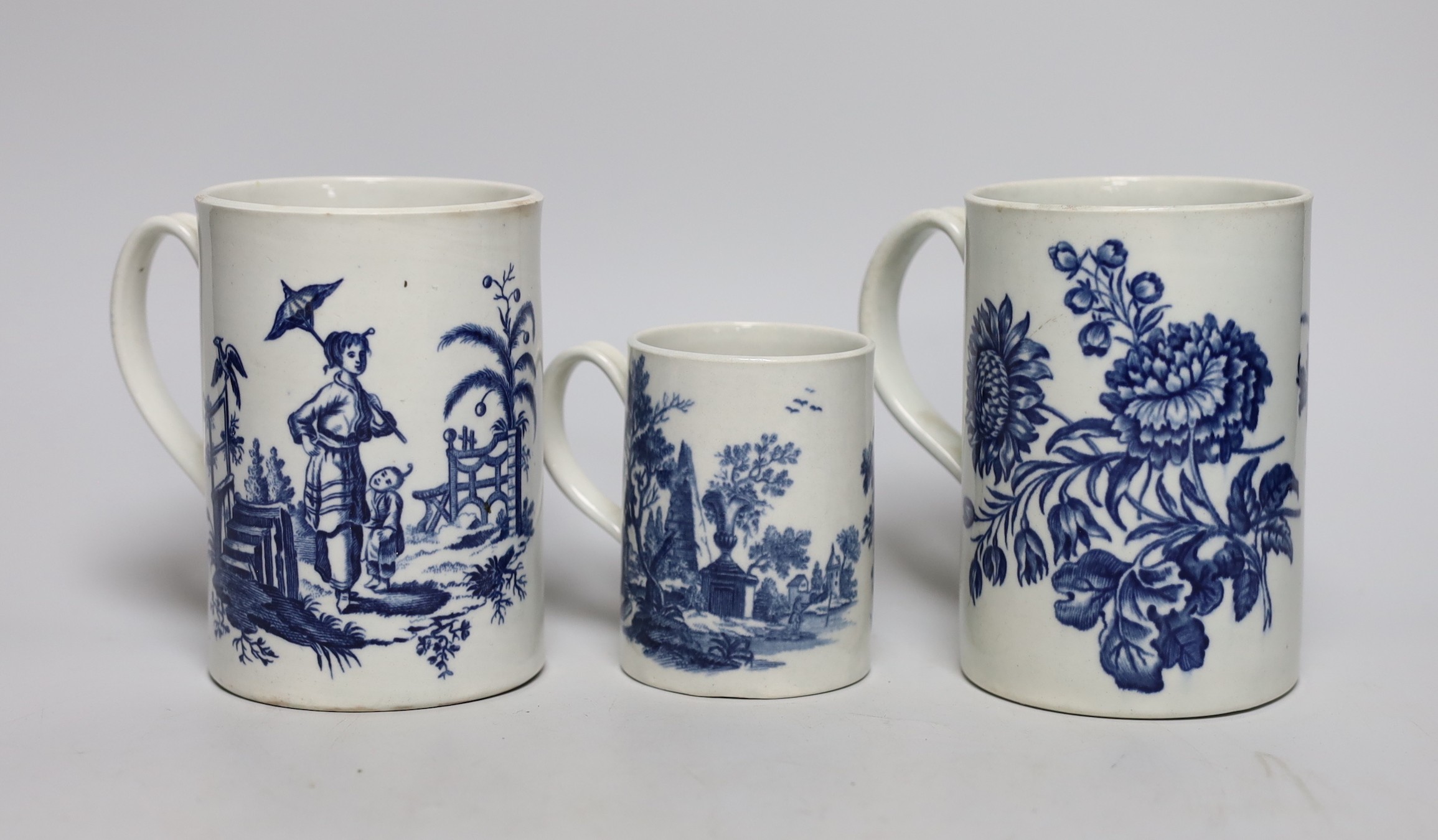 Three 18th century Worcester mugs, Three flowers, La Promenade, 12.5cms high                                                                                                                                                