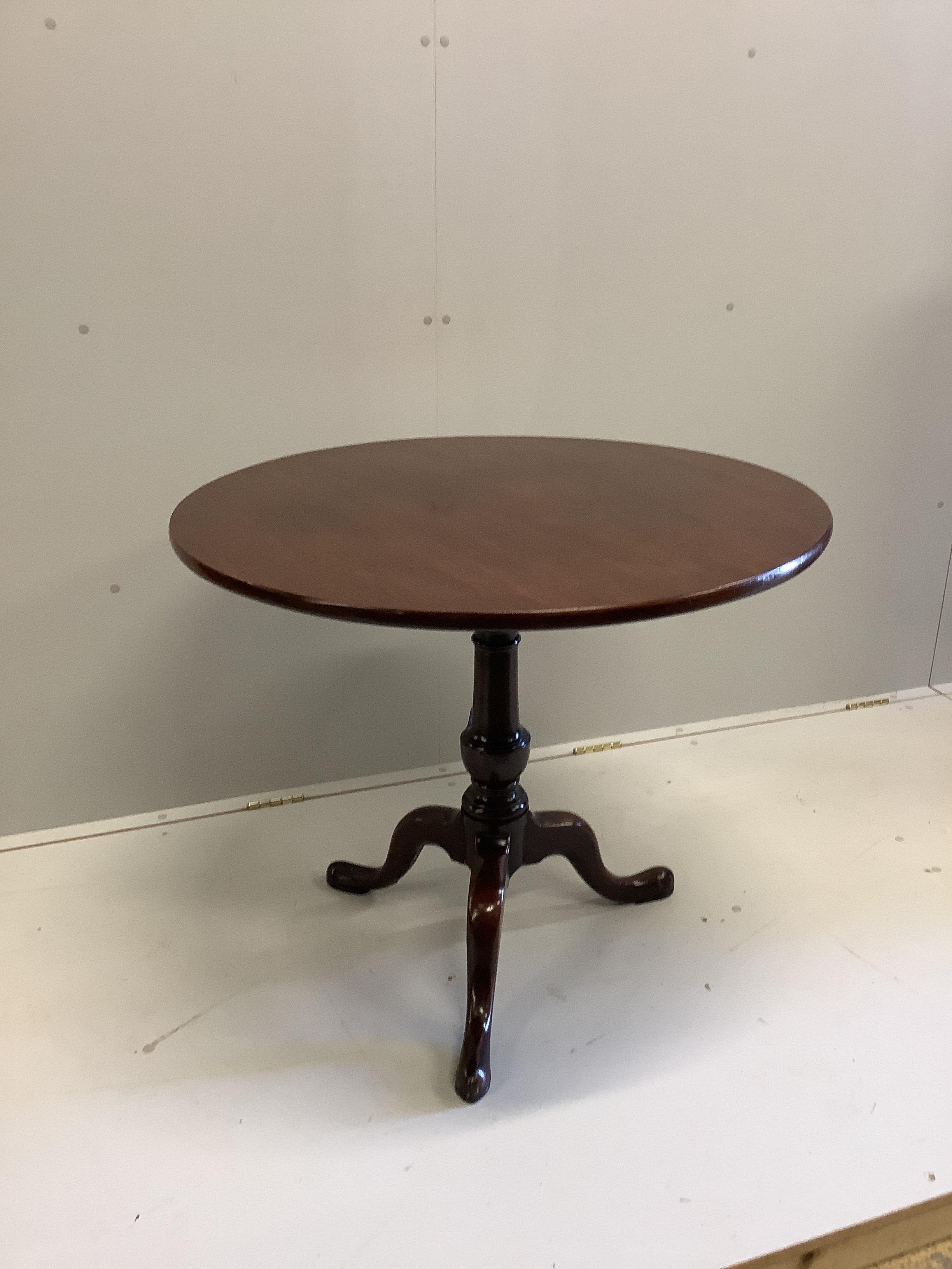 A George III circular mahogany tilt top birdcage tea table, diameter 87cm, height 72cm                                                                                                                                      