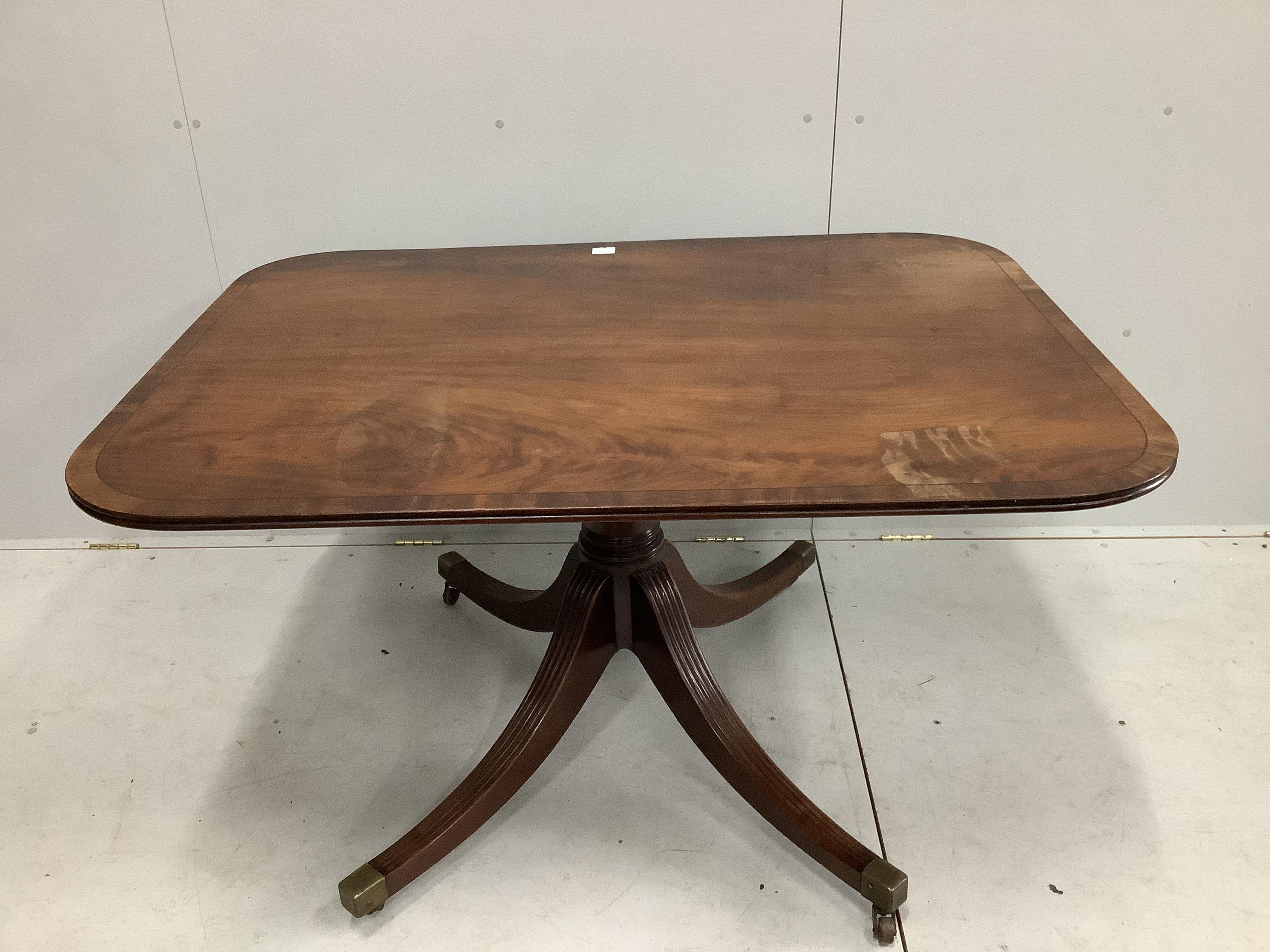 A George III rectangular banded mahogany tilt top table, width 131cm, depth 96cm, height 72cm                                                                                                                               