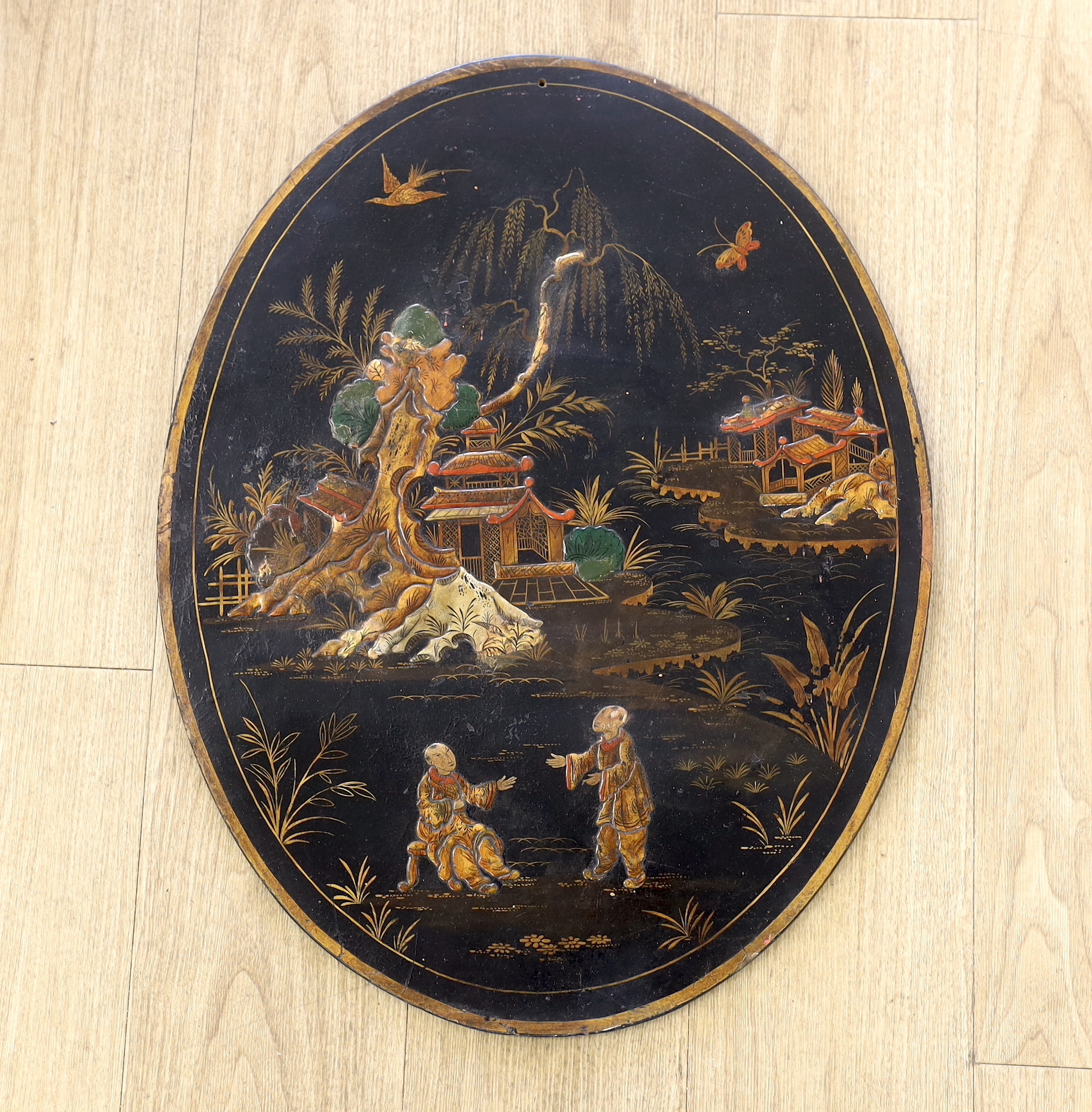 A Japanese oval lacquer panel, 66cm long                                                                                                                                                                                    
