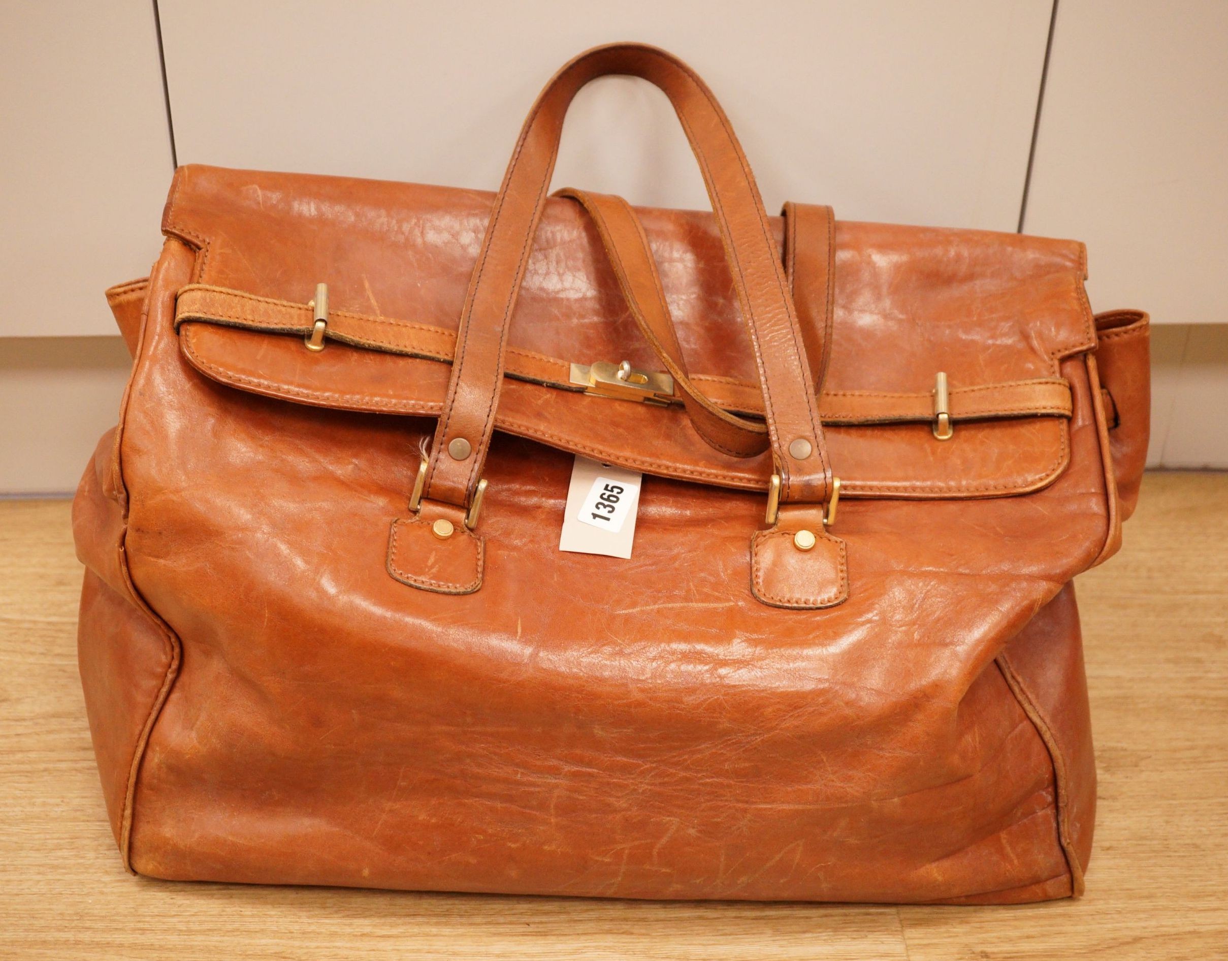A large Italian brown leather bag                                                                                                                                                                                           