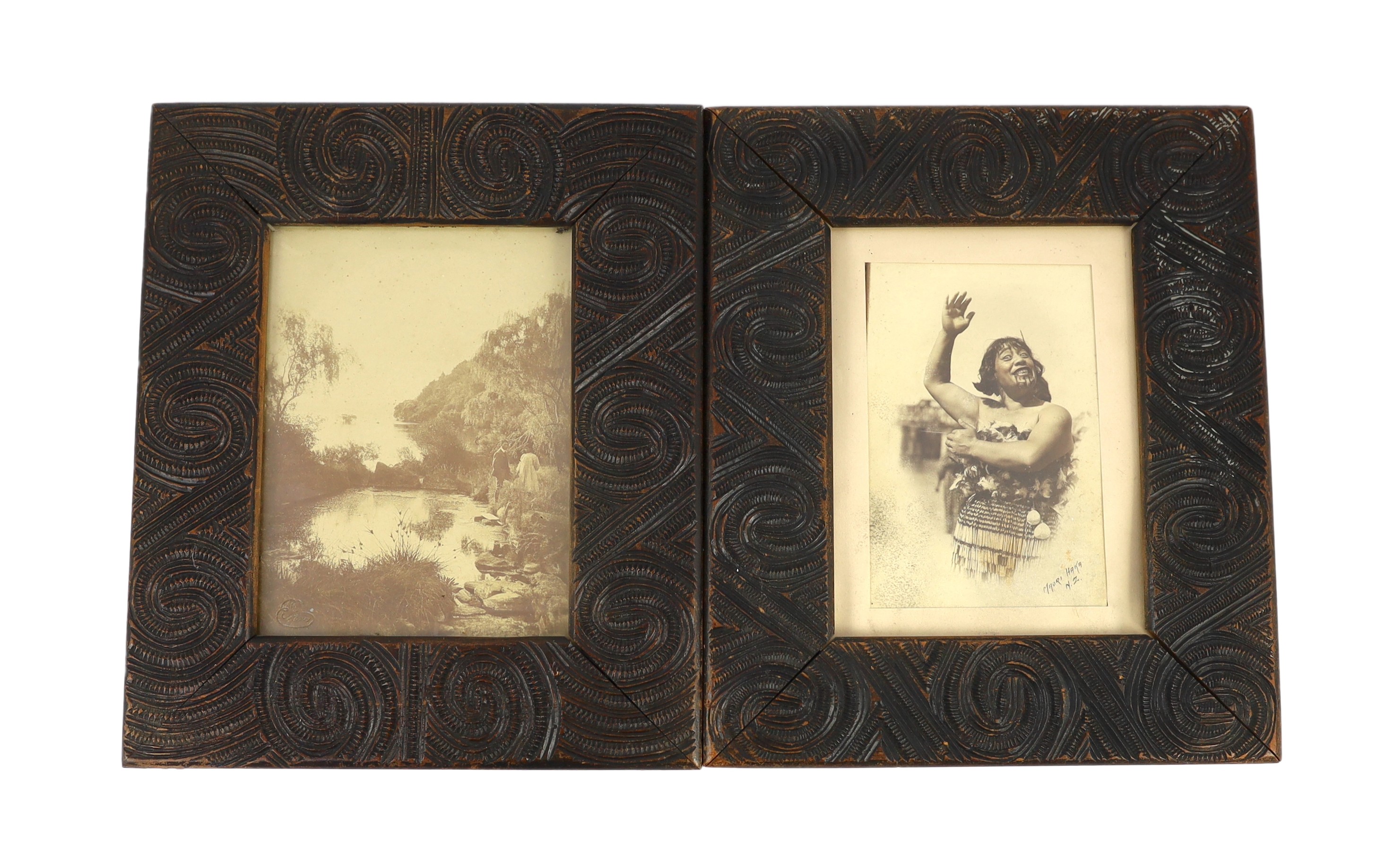 A pair of Maori carved wood photograph frames containing contemporary New Zealand photographs c.1900-10, frames 32.5 cm x 27 cm                                                                                             