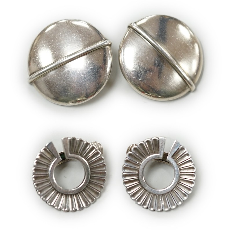 Two pairs of Georg Jensen sterling ear clips, design no. 232, 24mm and no. 92, with one Jensen box.                                                                                                                         