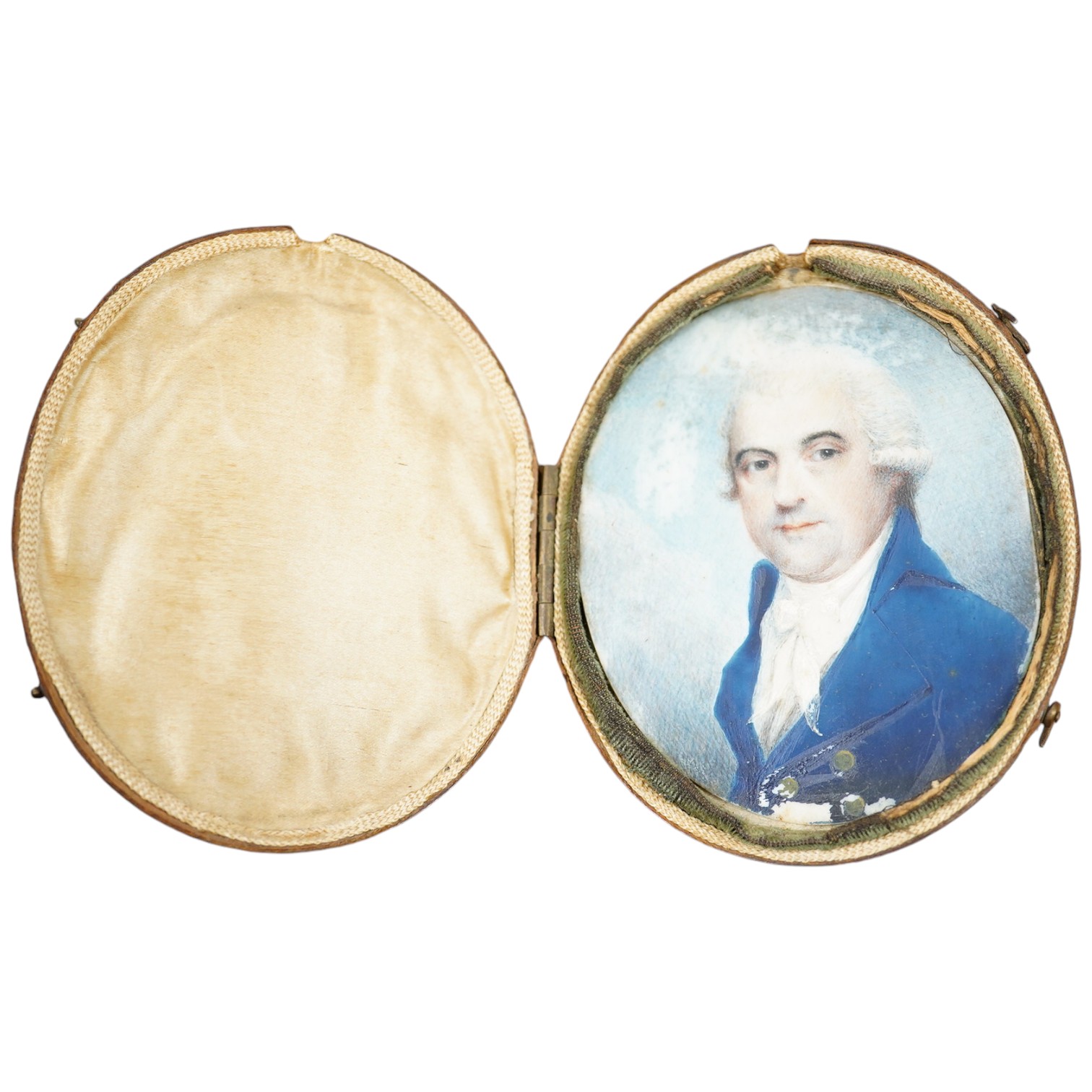 18th century, English School, oil on ivory, Portrait miniature of a gentleman wearing a blue frock coat, 7 x 6cm, housed in original Moroccan leather case. CITES Submission reference 3C2DKCRV. Condition - poor           