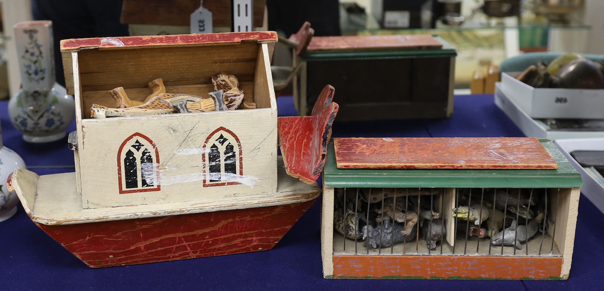 A War Relief Toy Works painted wood Noah's ark, a painted wood toy zoo cage and a quantity of animals                                                                                                                       