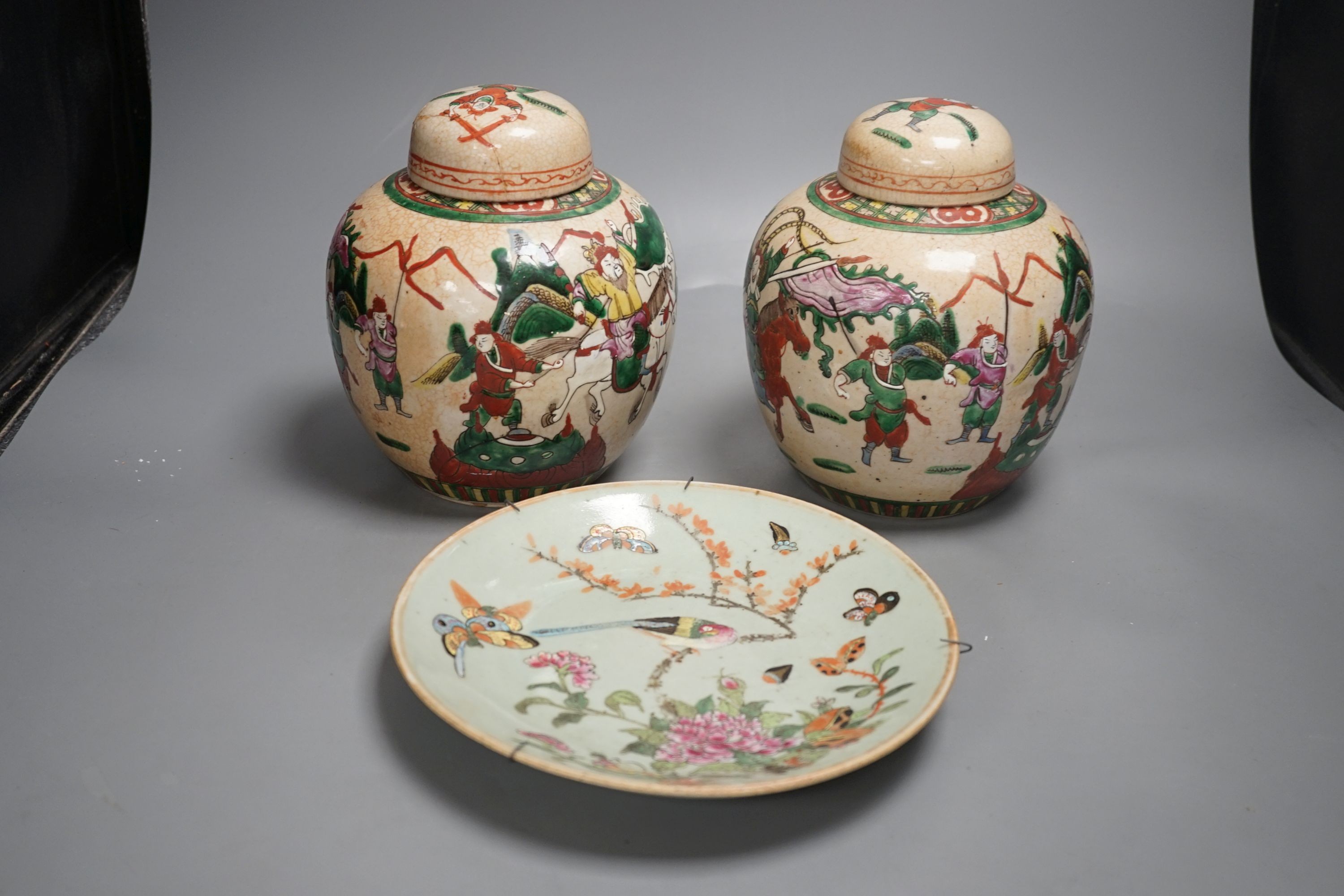 A pair of Chinese crackleware ginger jars, 20cm tall, and a celadon plate                                                                                                                                                   