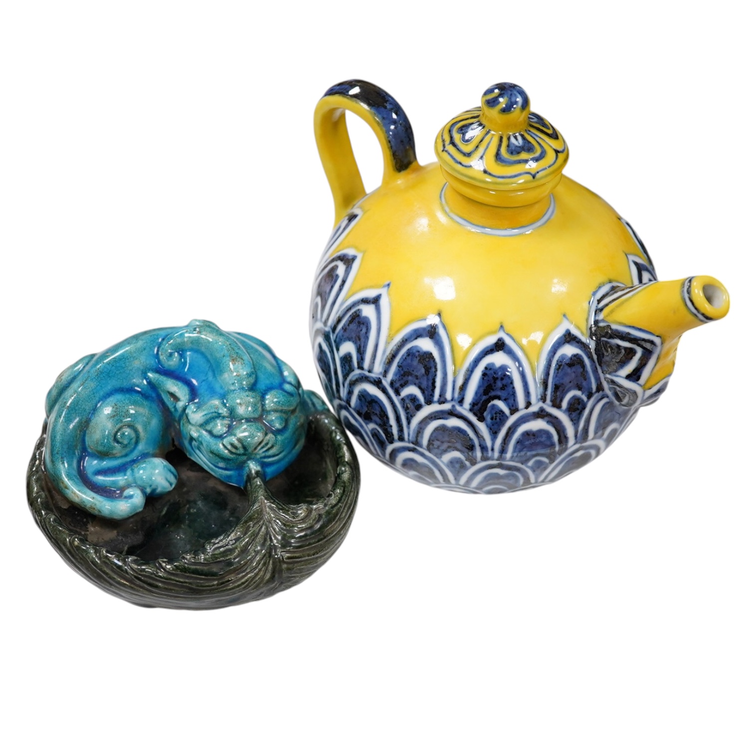 A Chinese yellow ground teapot, Xuande mark but later and a turquoise glazed ‘lion dog’ brush washer, tallest 13cm. Condition - good                                                                                        