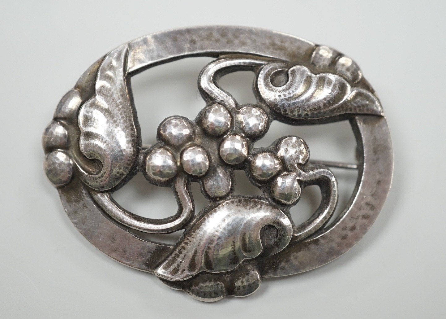 A Georg Jensen modern sterling silver oval leaf and berry brooch, design no. 101, 48mm, with Jensen box.                                                                                                                    