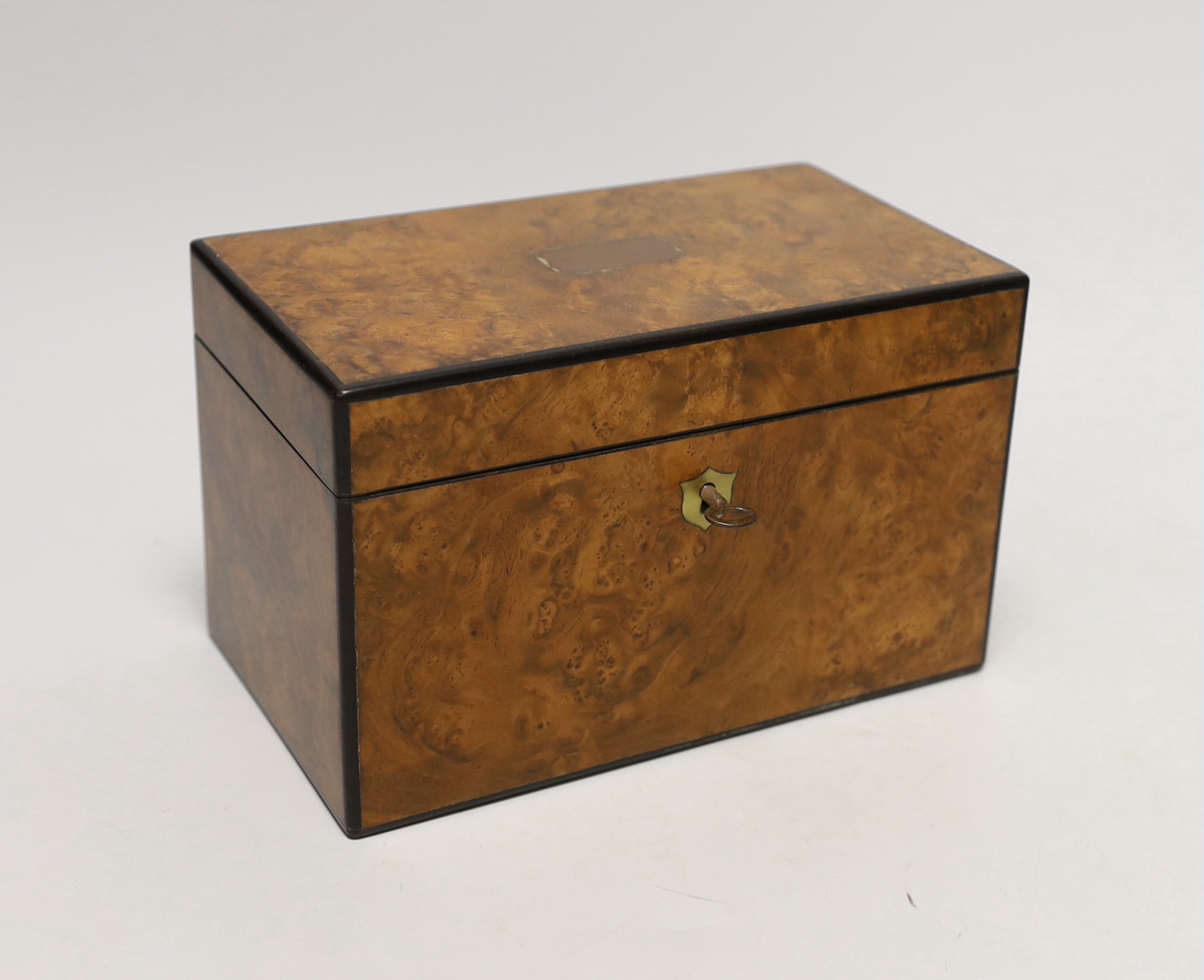 A 19th century burr walnut veneered tea caddy, with divisional interior and internal covers, 20cm wide                                                                                                                      