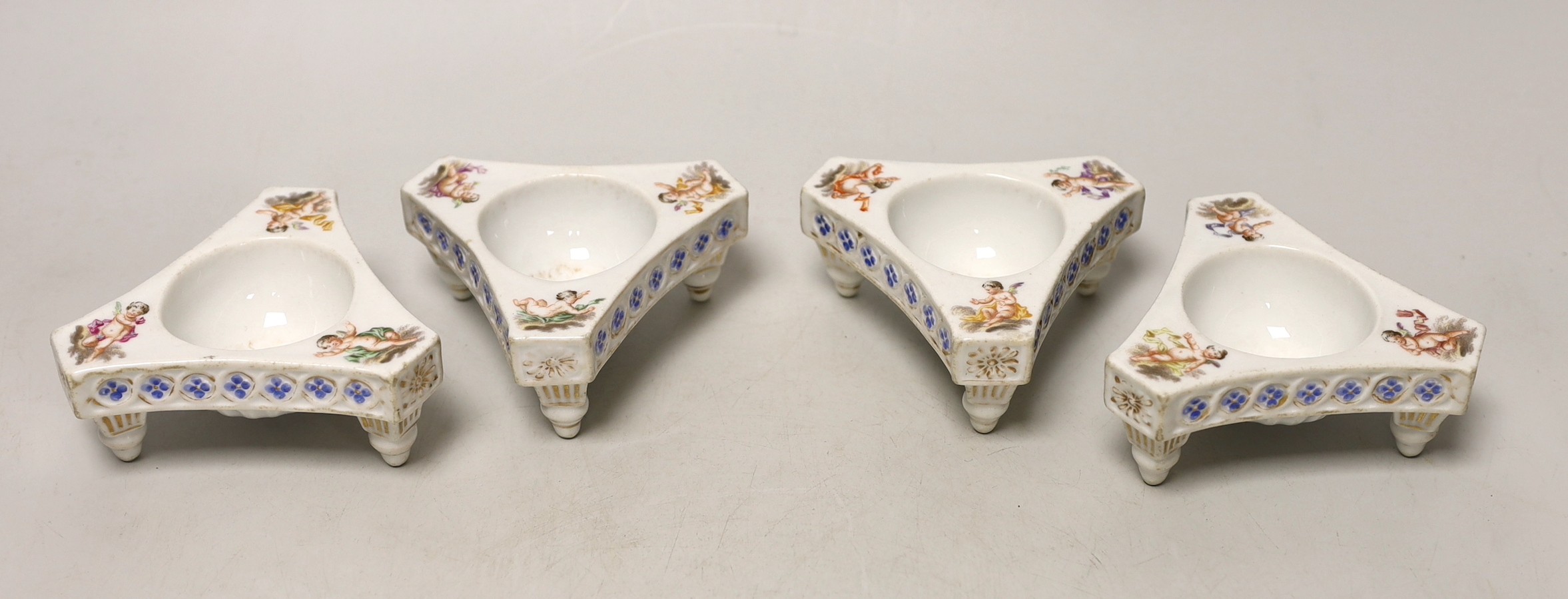 A set of four Dresden triangular cherub salts, Helena Wolfsohn atelier, 8cms wide                                                                                                                                           