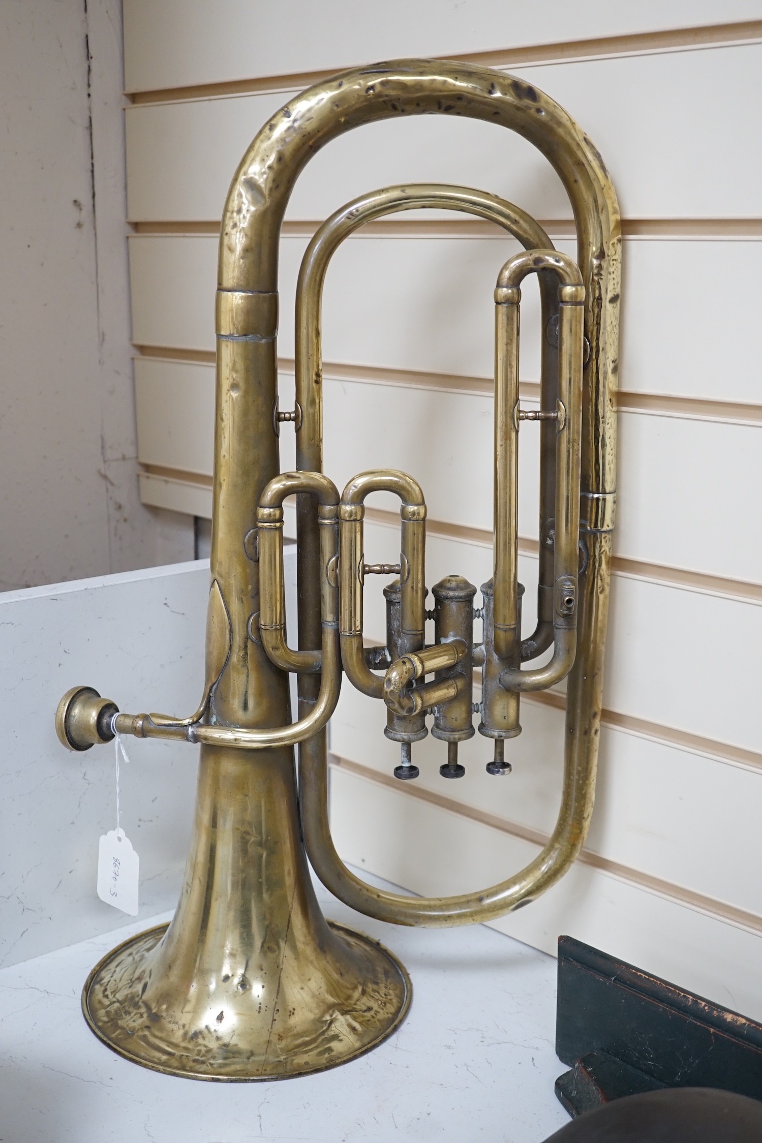 A brass euphonium by Butler, Haymarket, London and Dublin, 57cms long                                                                                                                                                       
