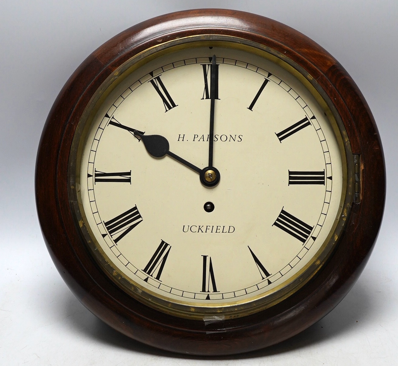 H. Parsons of Uckfield, a mahogany wall clock, 34cm. Condition - poor to fair, not tested as working                                                                                                                        