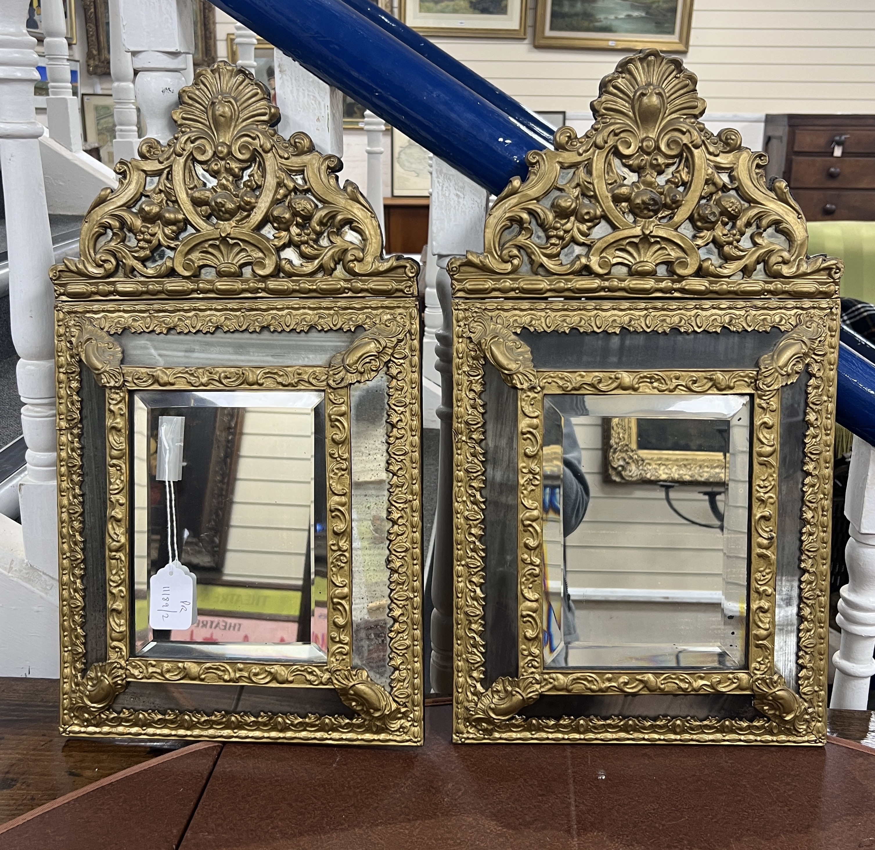 A pair of 19th century Dutch repousse wall mirrors, width 33cm, height 60cm                                                                                                                                                 