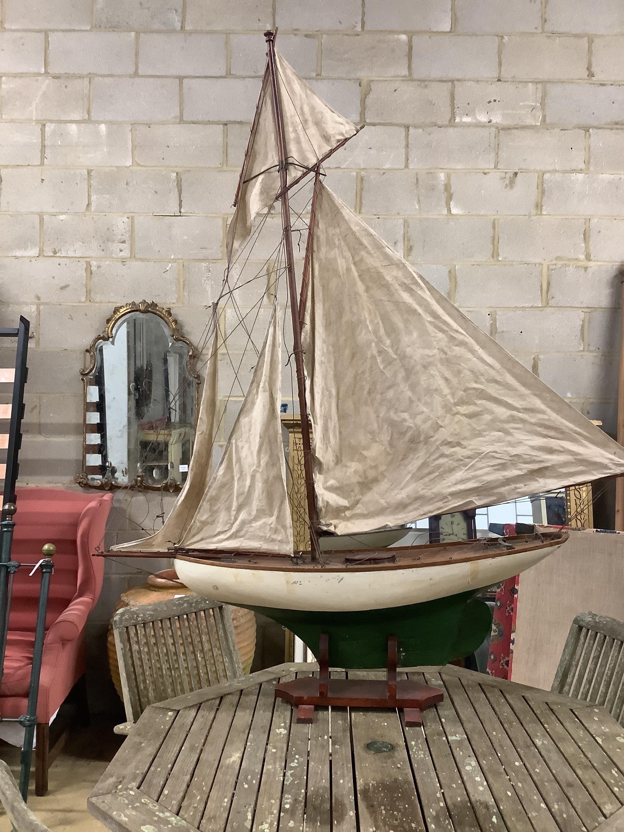 An early 20th century pond yacht c.1920, length 156cm, height with stand 190cm                                                                                                                                              