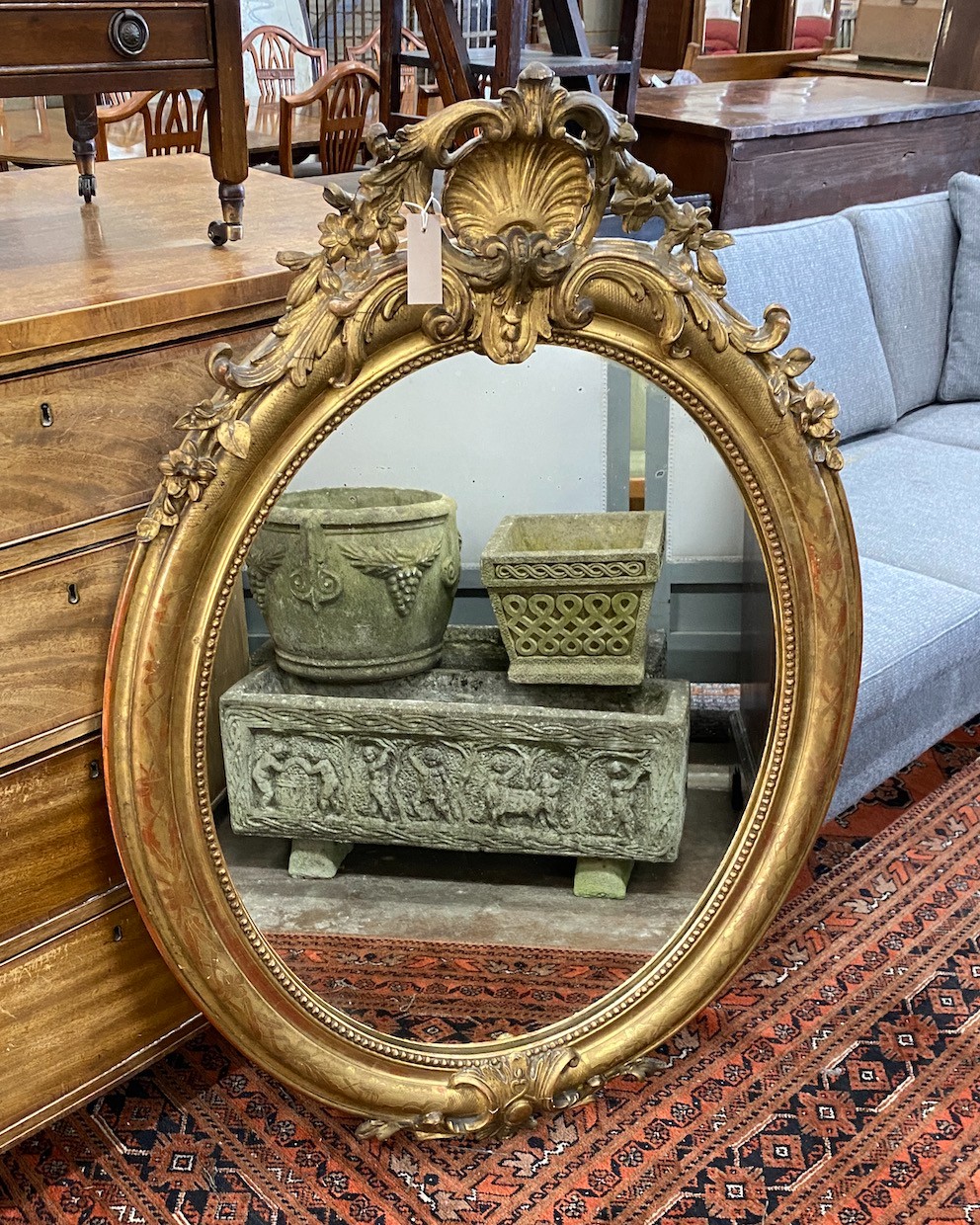 A 19th century French oval giltwood and composition wall mirror, width 80cm, height 119cm.                                                                                                                                  
