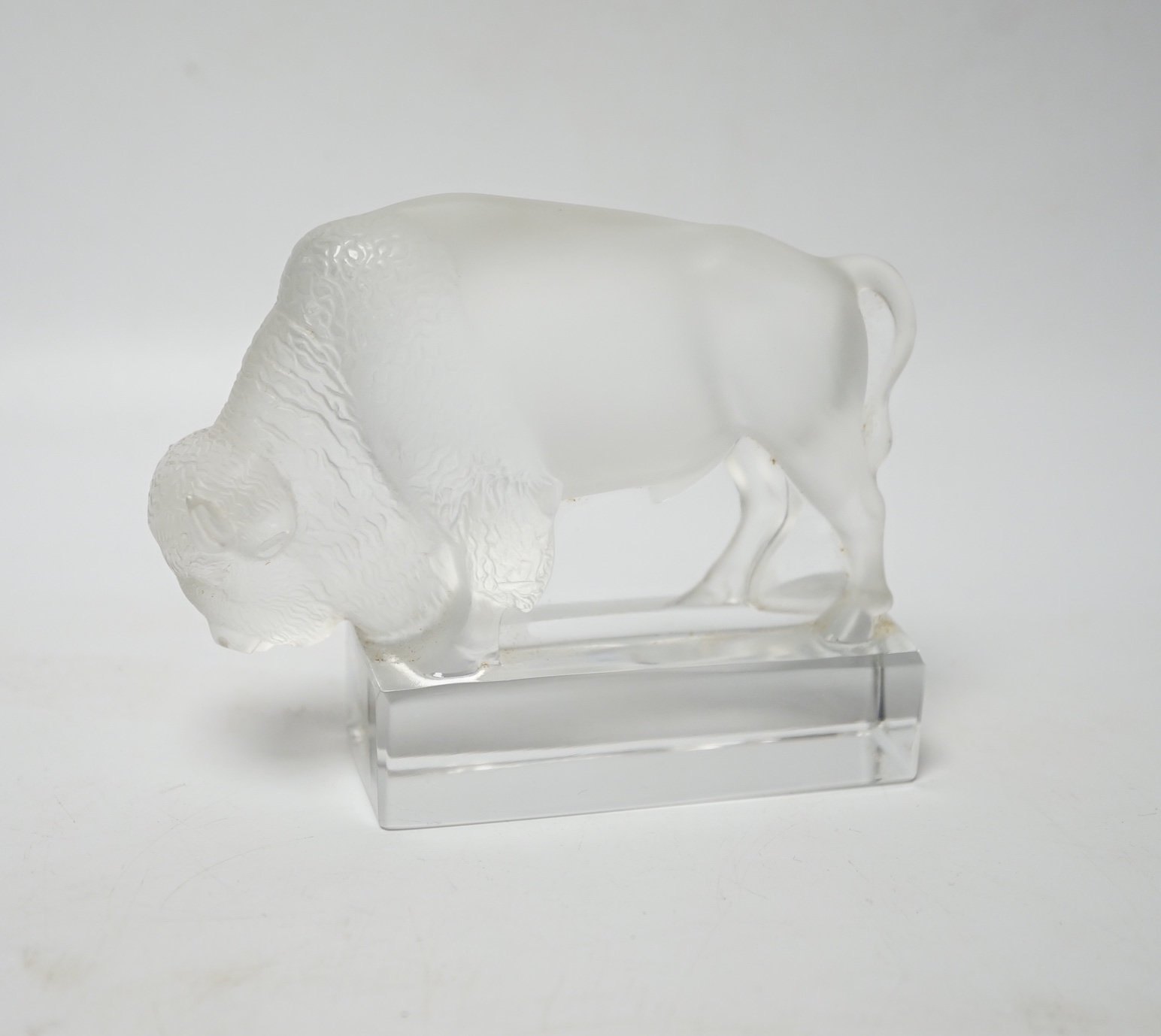 Rene Lalique, a frosted glass paperweight modelled as a bison, signed ‘Lalique France’ to base 12.5cm wide                                                                                                                  