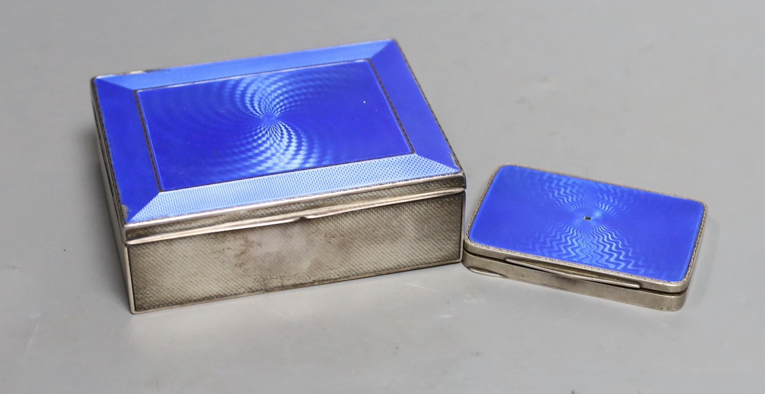 A George V silver and blue enamel cigarette box, import marks for London, 1928, 11.3cm and a Swedish white metal and enamel compact.                                                                                        