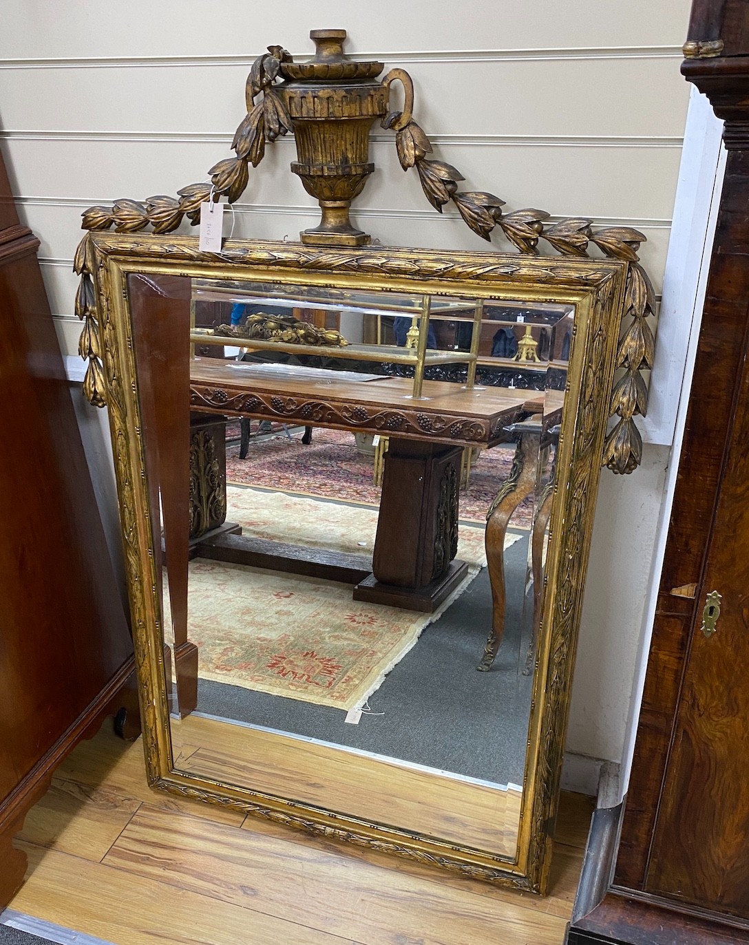 A 19th century French rectangular giltwood wall mirror with urn surmount, width 96cm, height 140cm                                                                                                                          