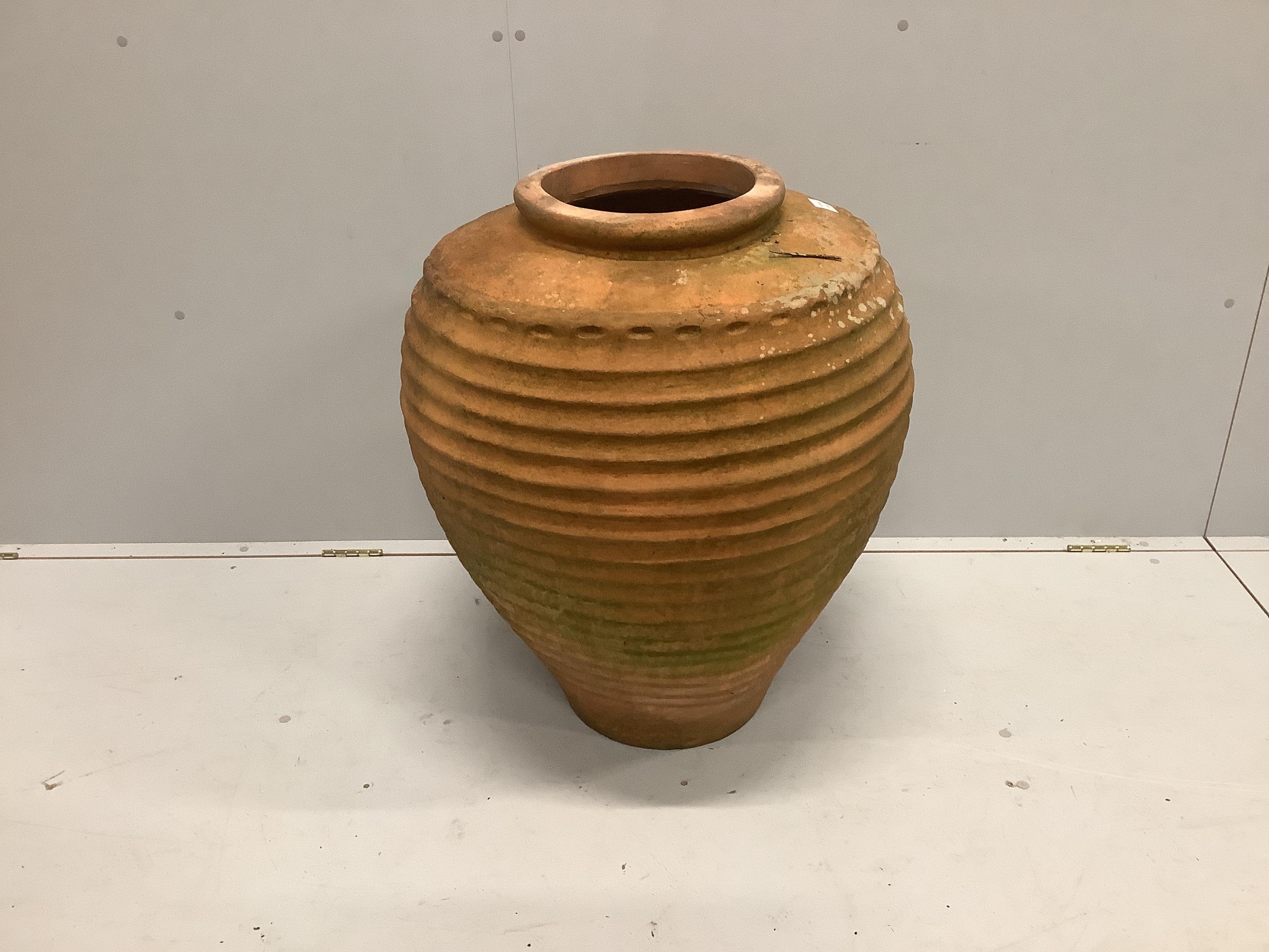 A Greek style terracotta oil jar, height 76cm                                                                                                                                                                               
