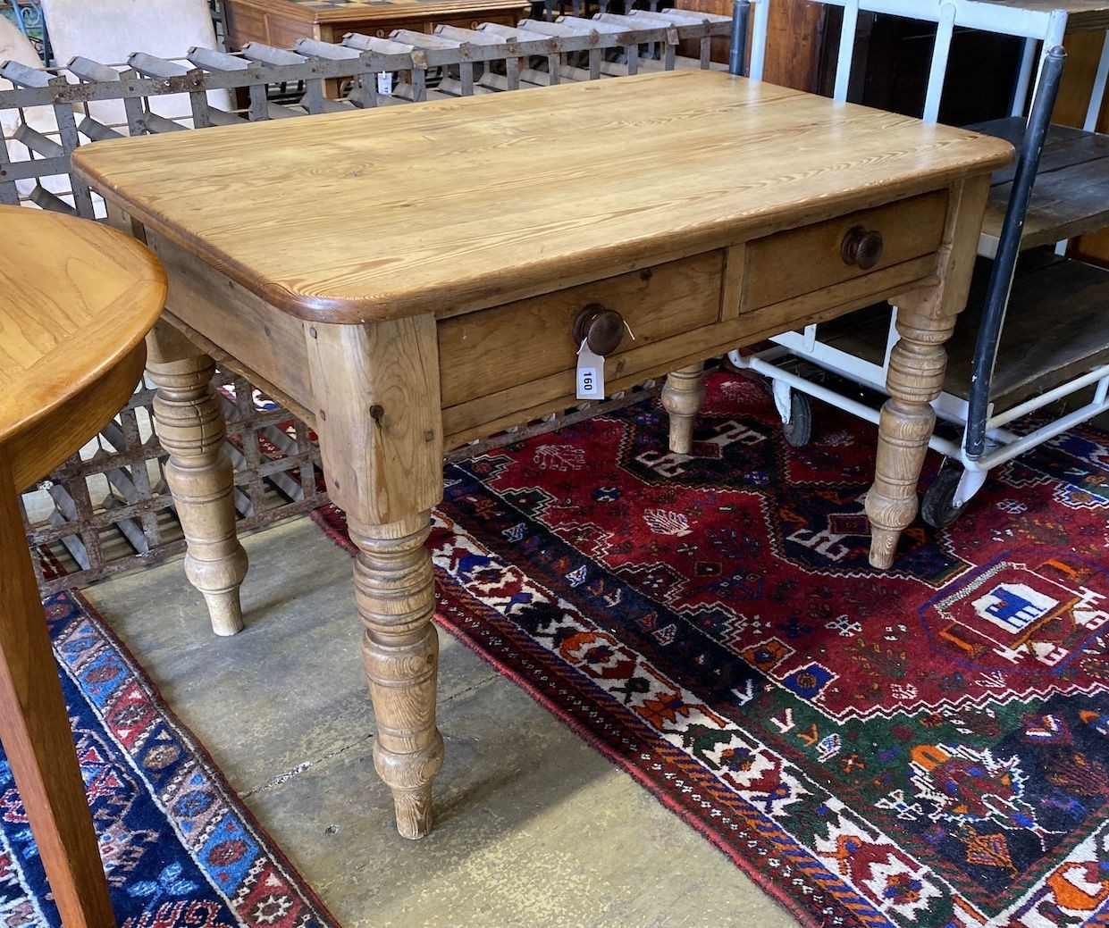 A Victorian pitch pine two drawer kitchen table, width 118cm, depth 42cm, height 78cm                                                                                                                                       