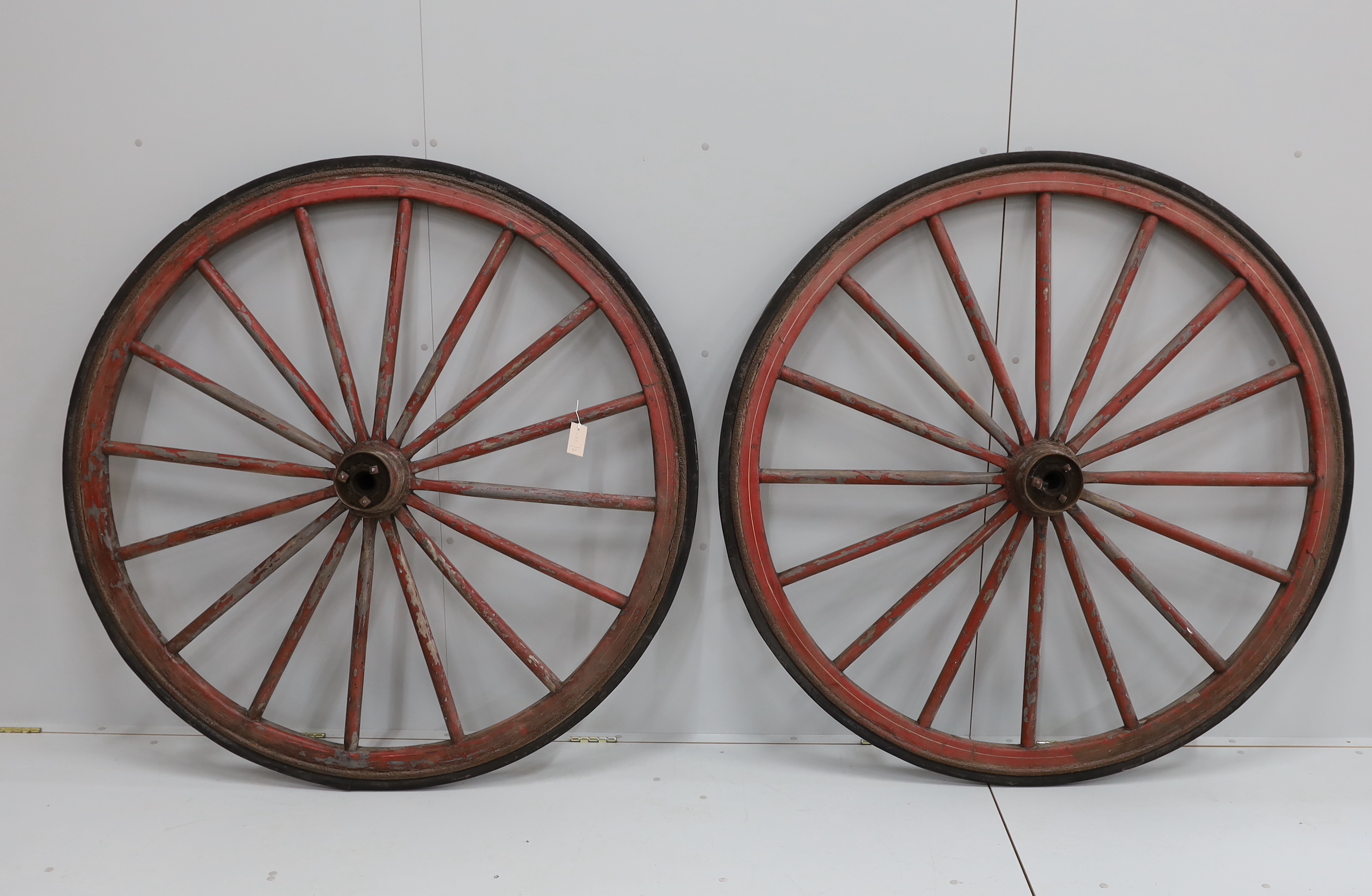 A pair of vintage cartwheels, diameter 136cm                                                                                                                                                                                