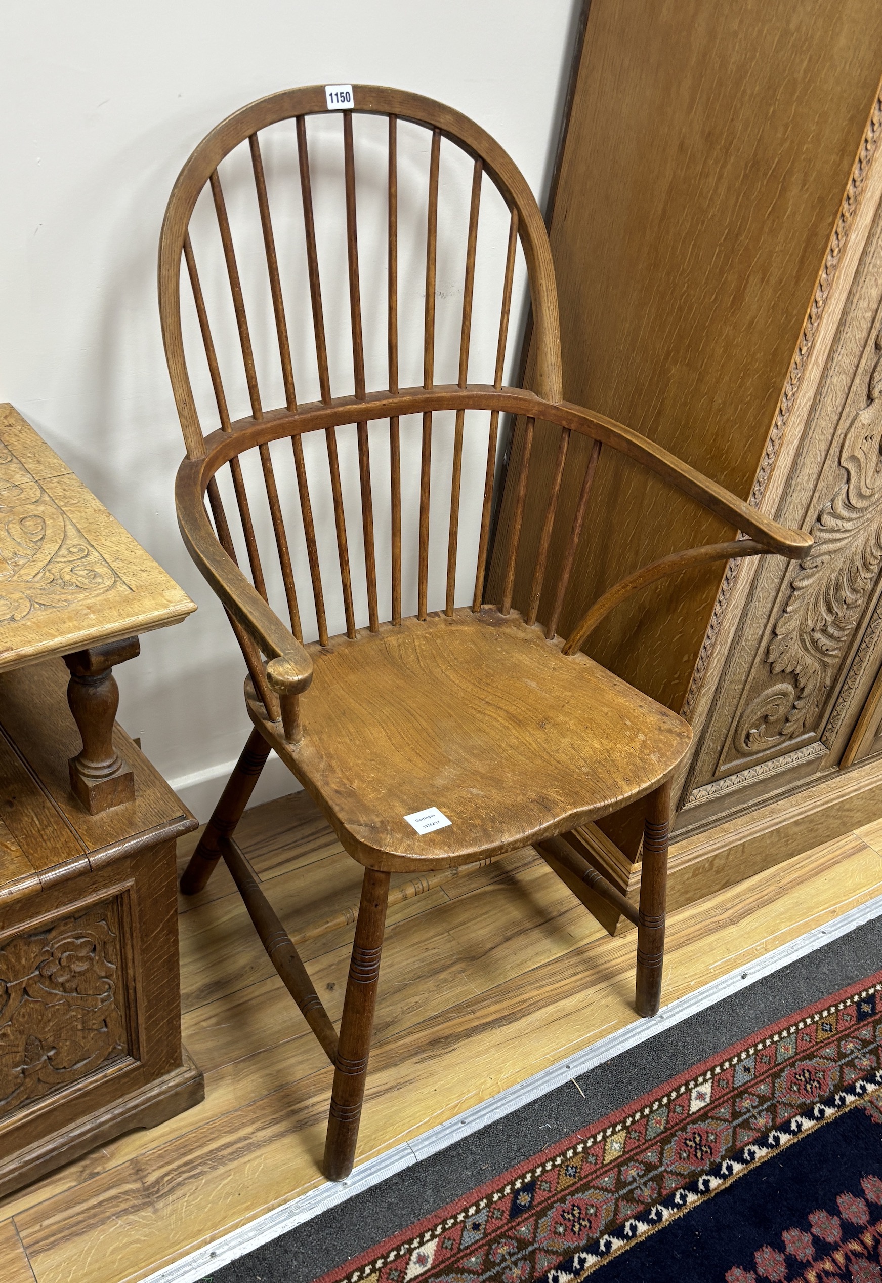 An elm and beech Windsor comb back elbow chair, width 65cm, depth 42cm, height 108cm                                                                                                                                        