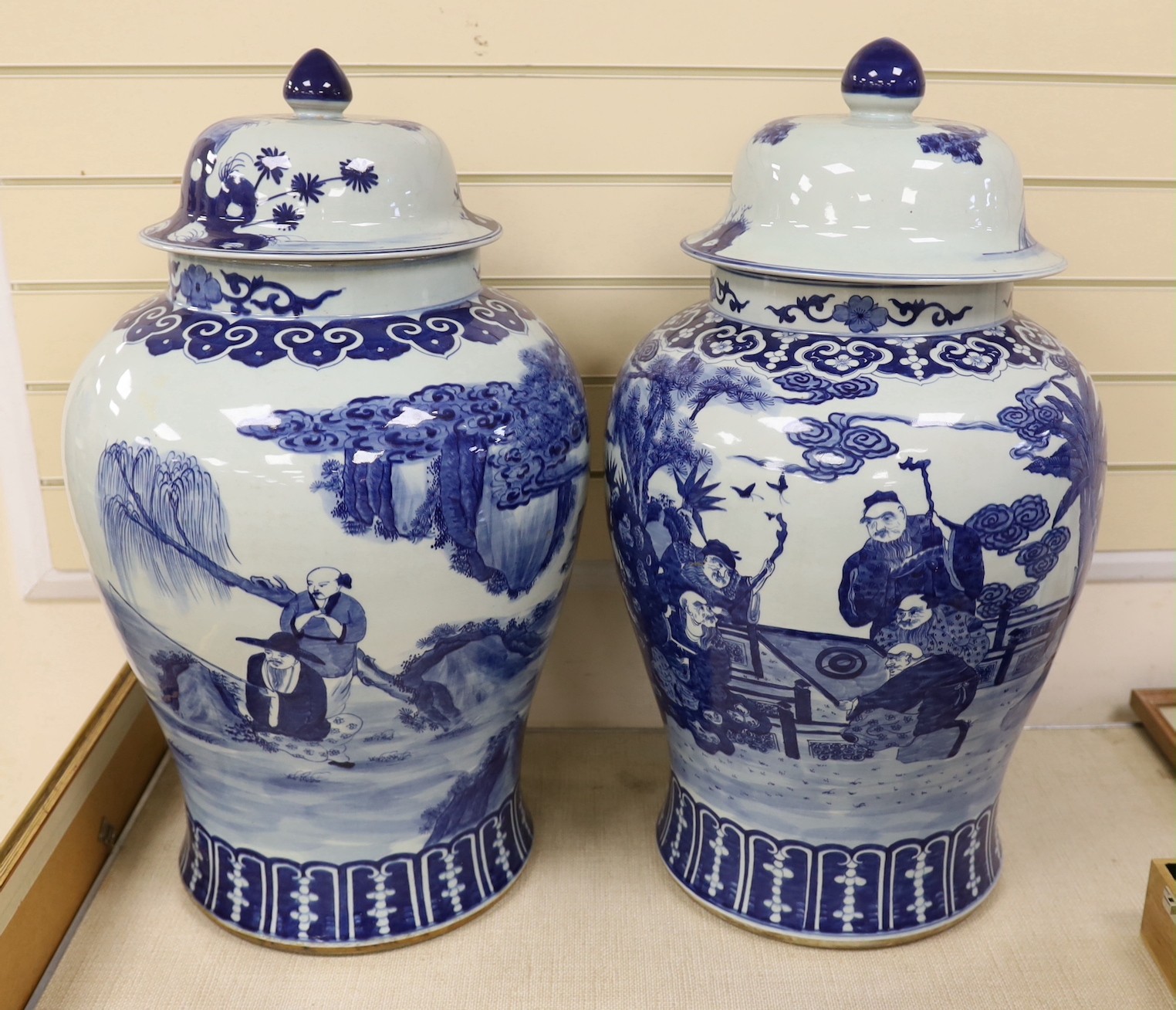 A pair of large Chinese blue and white jars and covers, 75 cms high.                                                                                                                                                        