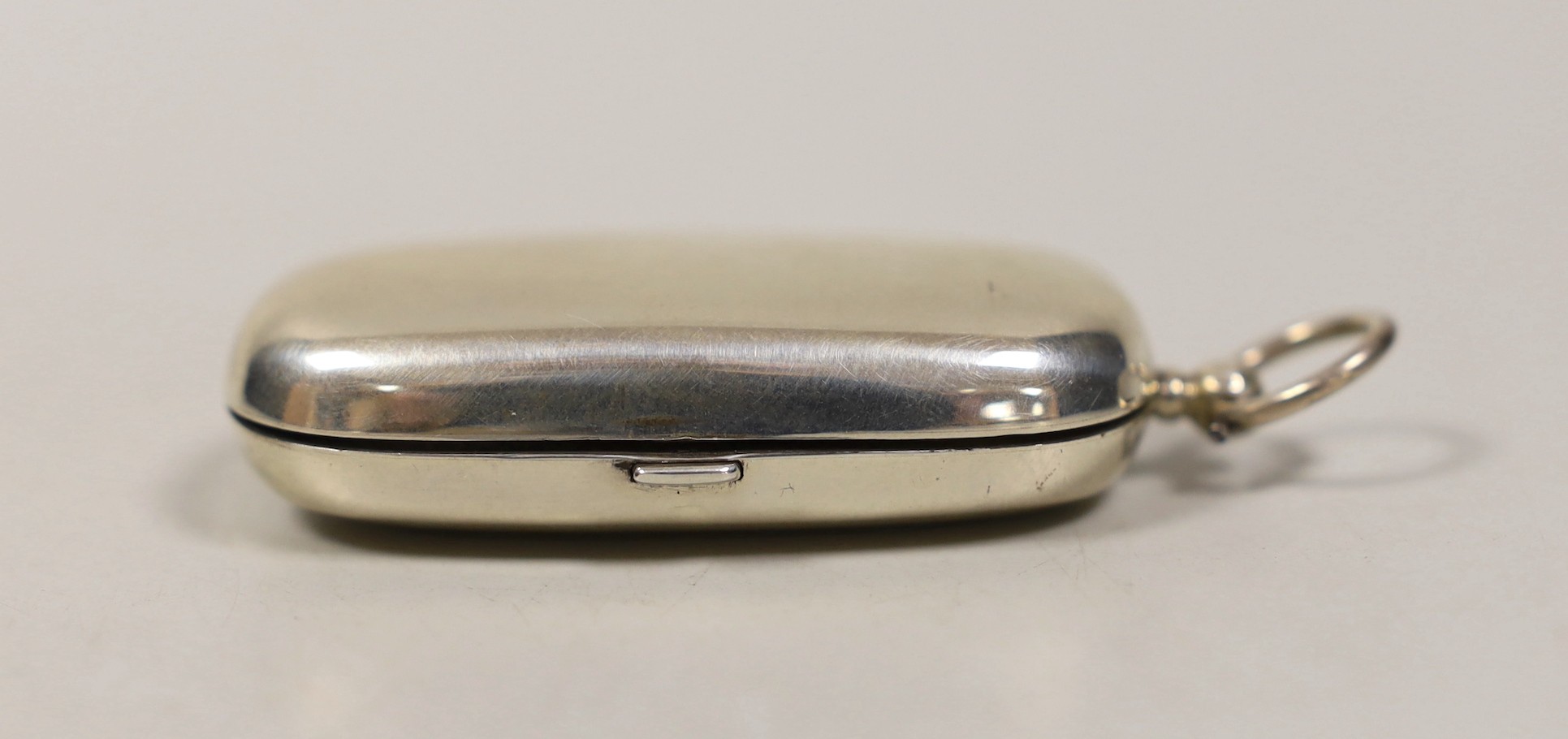 An Edwardian silver combination sovereign / half sovereign and stamp case, maker E.E.T. Birmingham, 1907, overall 74mm.                                                                                                     