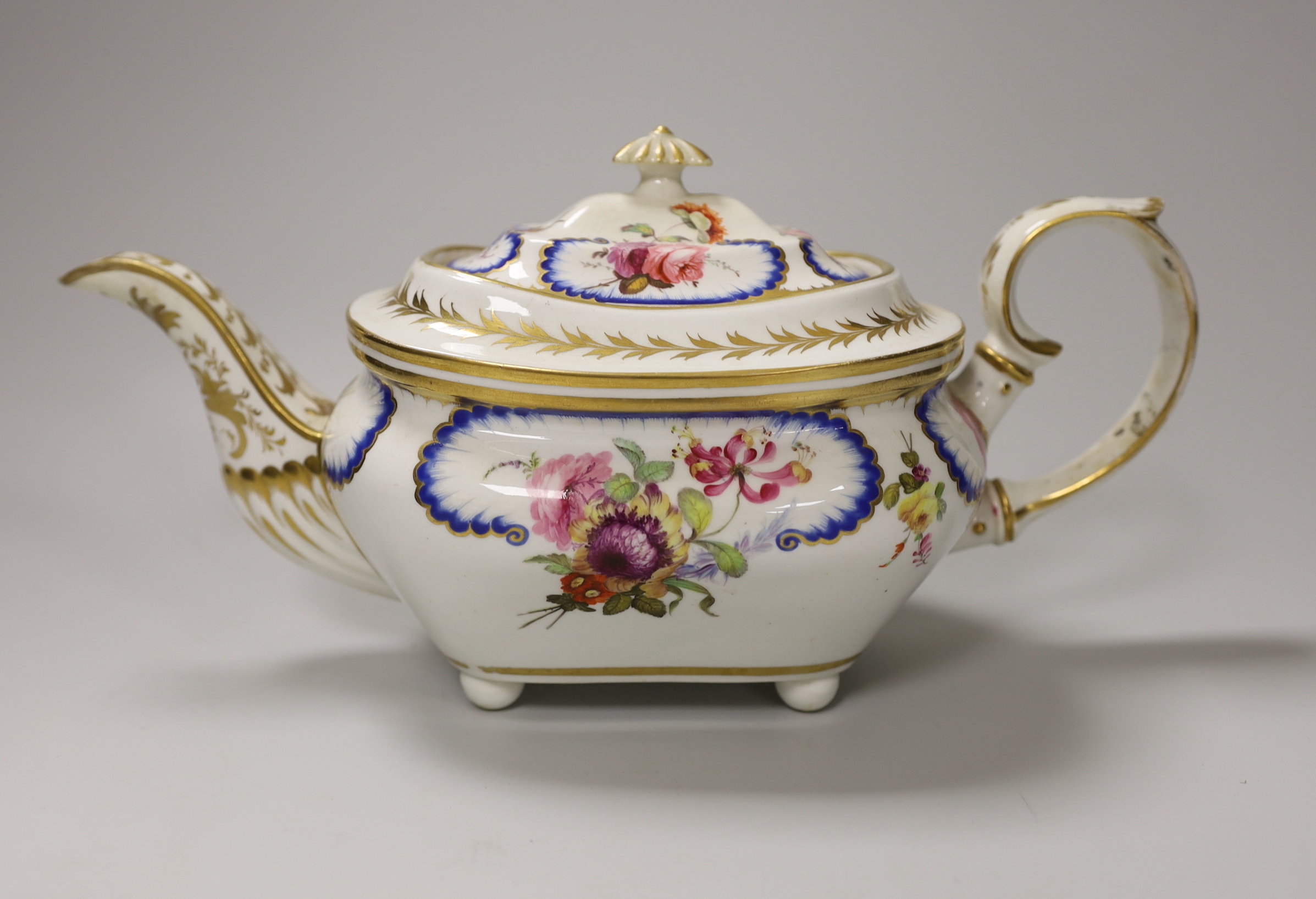 A Derby teapot and cover in Sevres style, hand painted with flowers, 30cm wide                                                                                                                                              