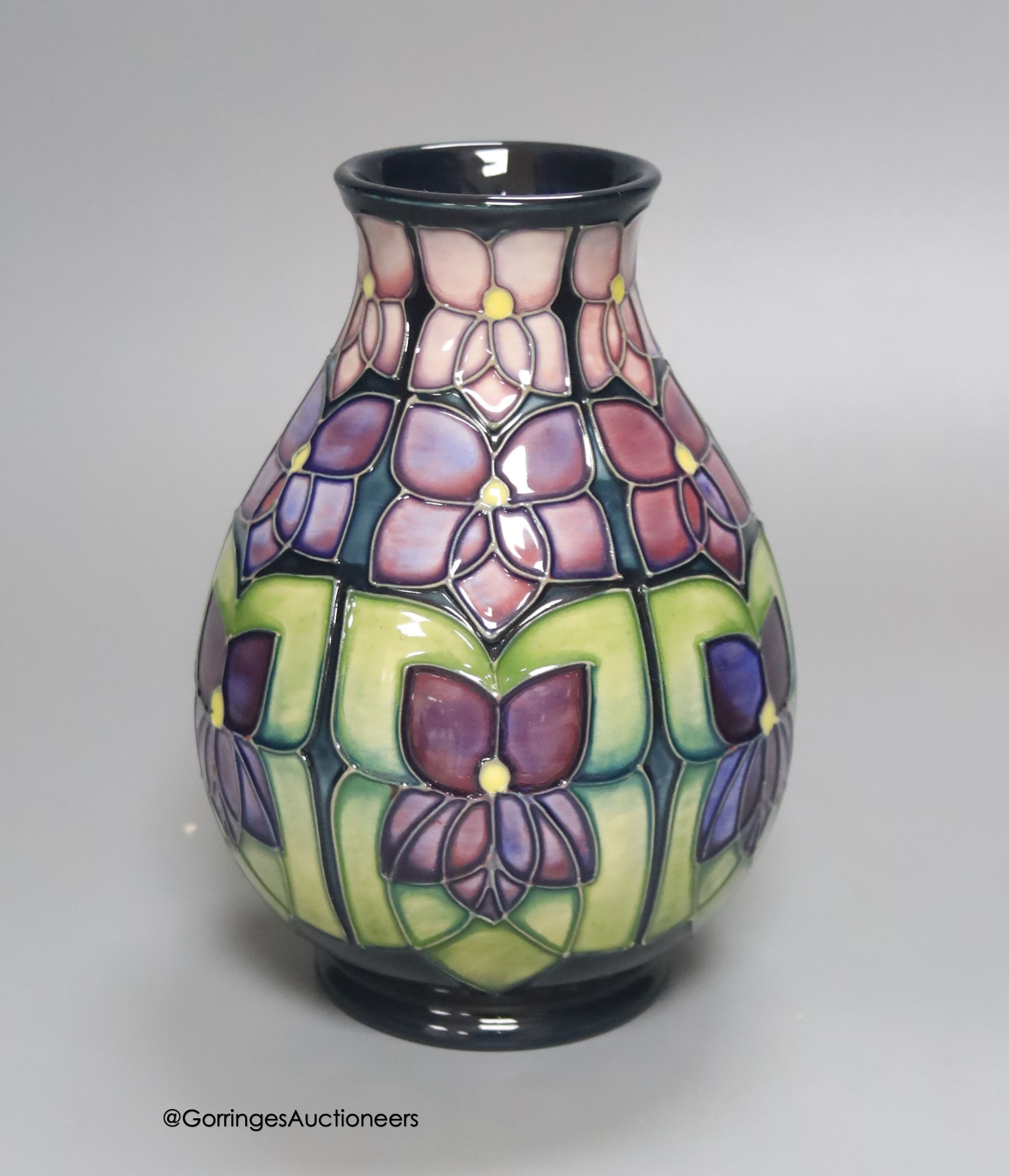 A Moorcroft Violets pattern vase, height 19cm                                                                                                                                                                               