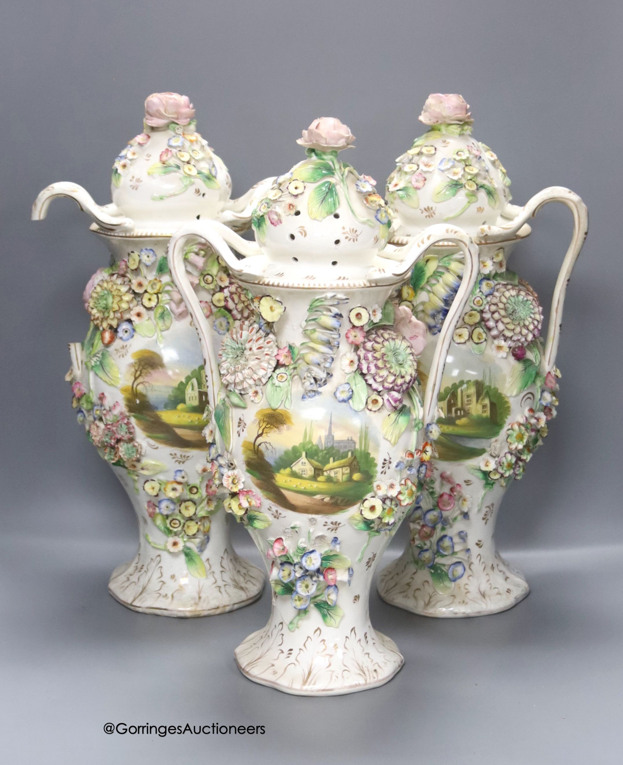 A set of three Coalbrookdale style vases and covers, height 42cm                                                                                                                                                            