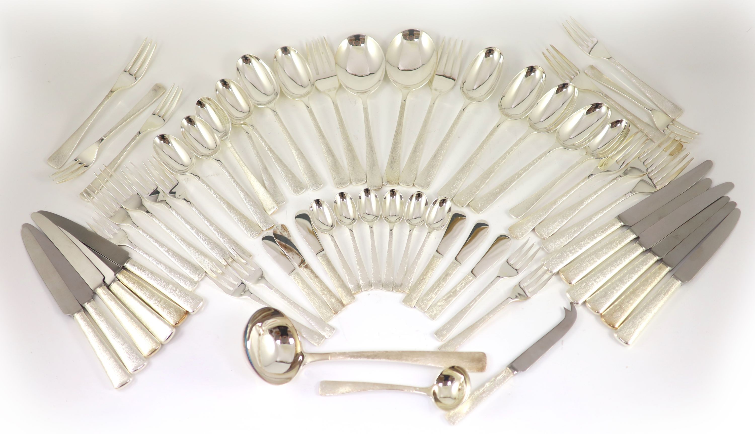 A good part textured silver canteen of cutlery for six by Adrian Gerald Benney                                                                                                                                              