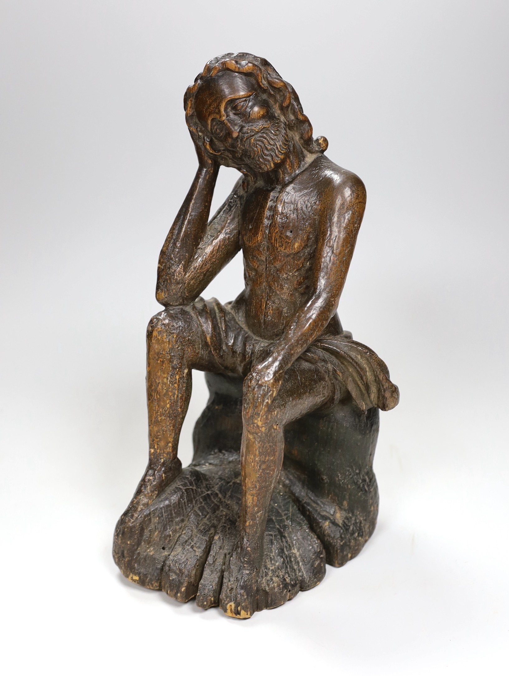 A 17th/18th century Italian limewood figural carving of Jesus perched, 31cm                                                                                                                                                 