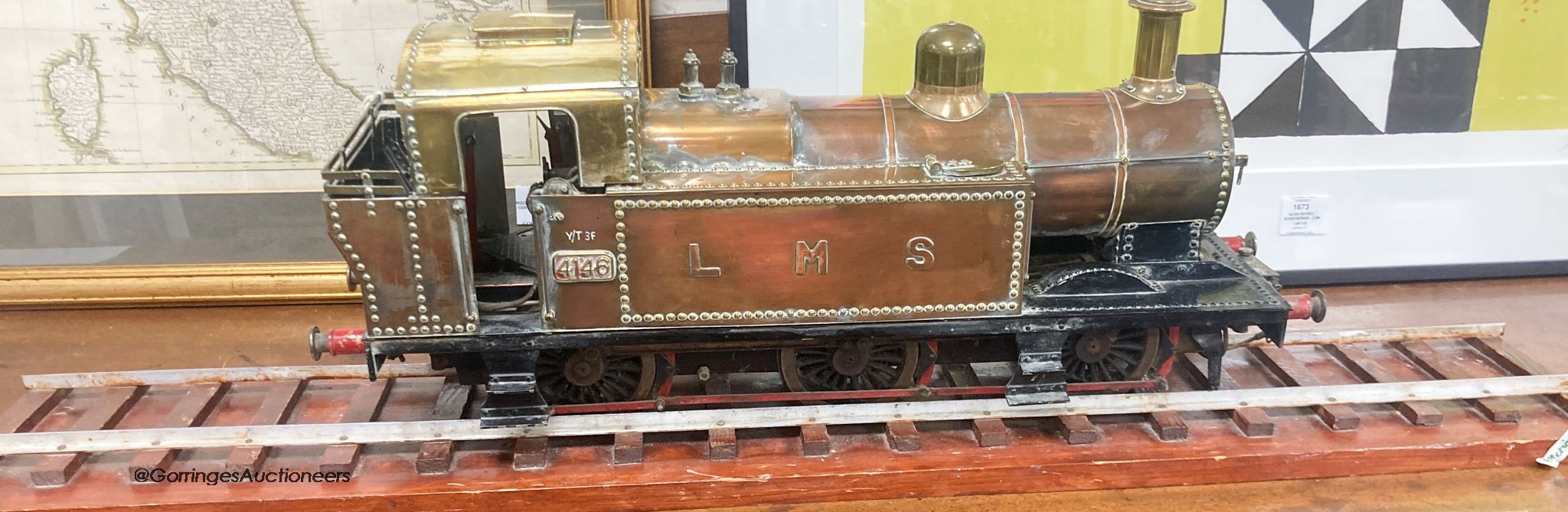 A mid 20th century scratch built 3 1/2" (9cm) gauge LMS 0-6-0 tank locomotive in copper, iron and brass with a length of track and pine case                                                                                