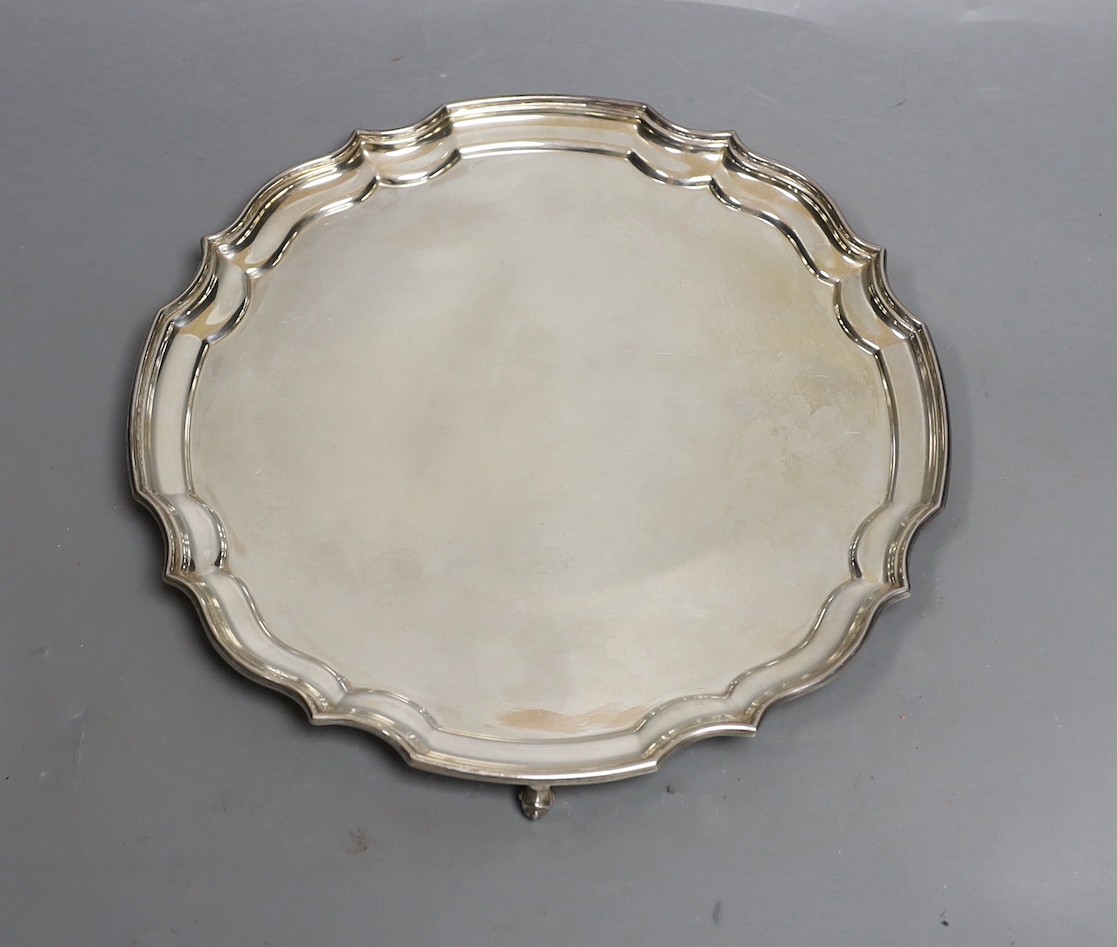 A modern silver salver with scroll feet and inscription verso, maker, HB, London, 1972, 25.3cm, 14.9oz.                                                                                                                     