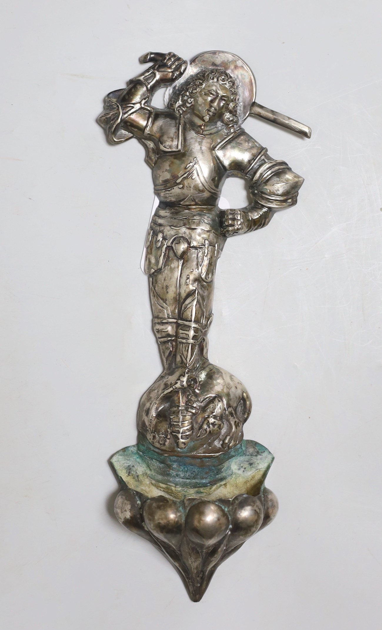 A continental white metal holy water stoop, 27cms high                                                                                                                                                                      