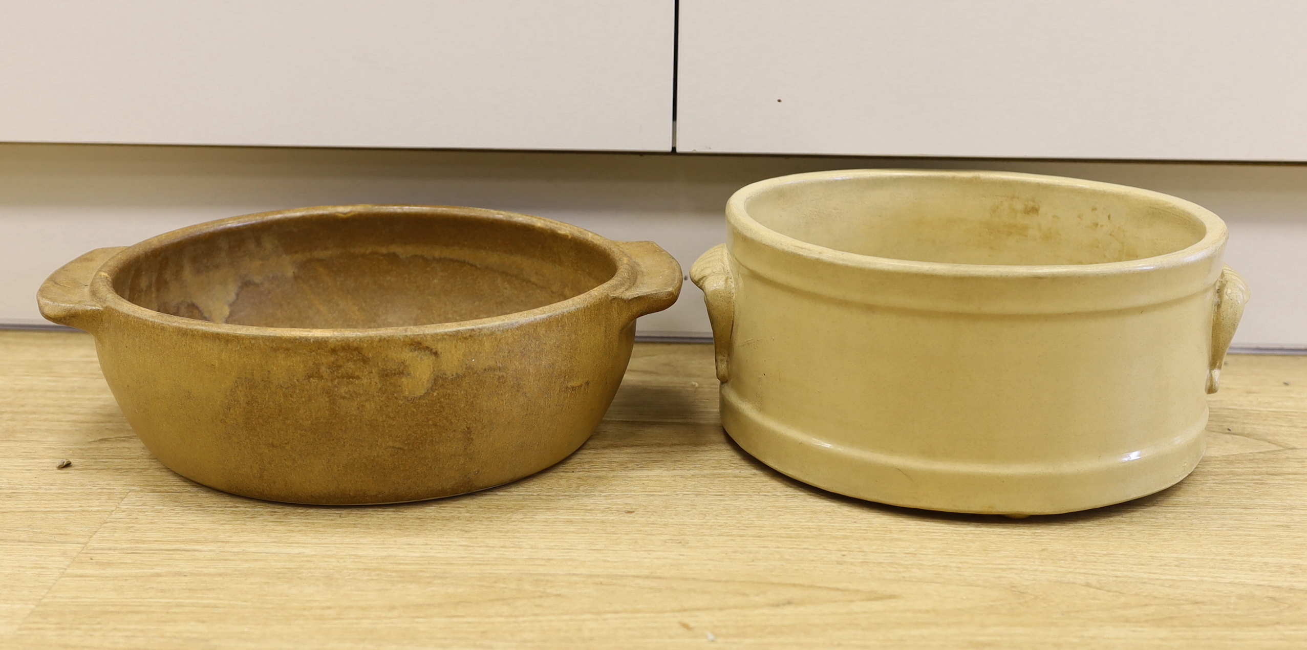 Two circular stoneware bowls including a Moira Pottery example with stamp to the base, the largest 38cm wide                                                                                                                