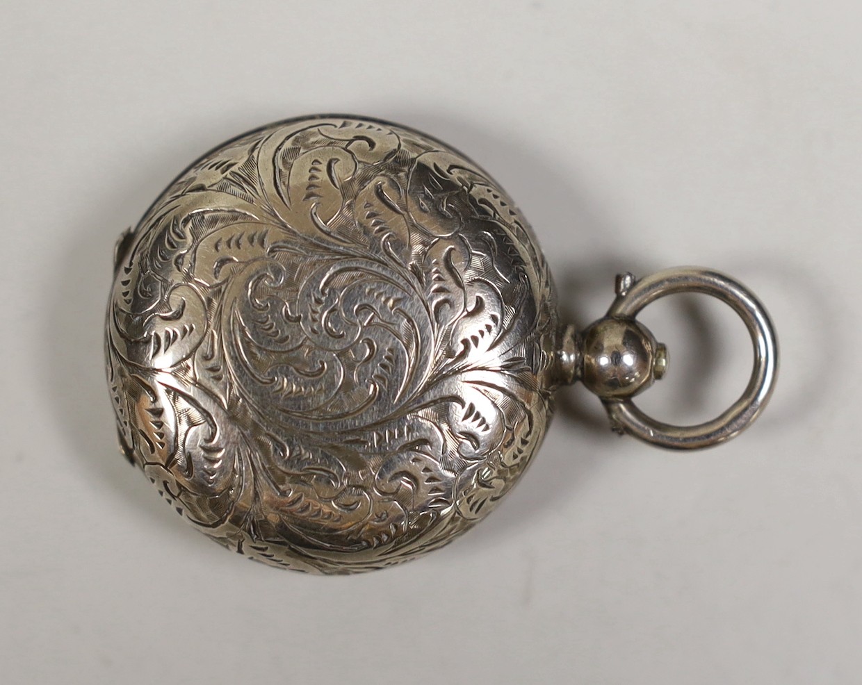 A late Victorian engraved silver sovereign case, John Milward Banks, Birmingham 1888, 30mm.                                                                                                                                 