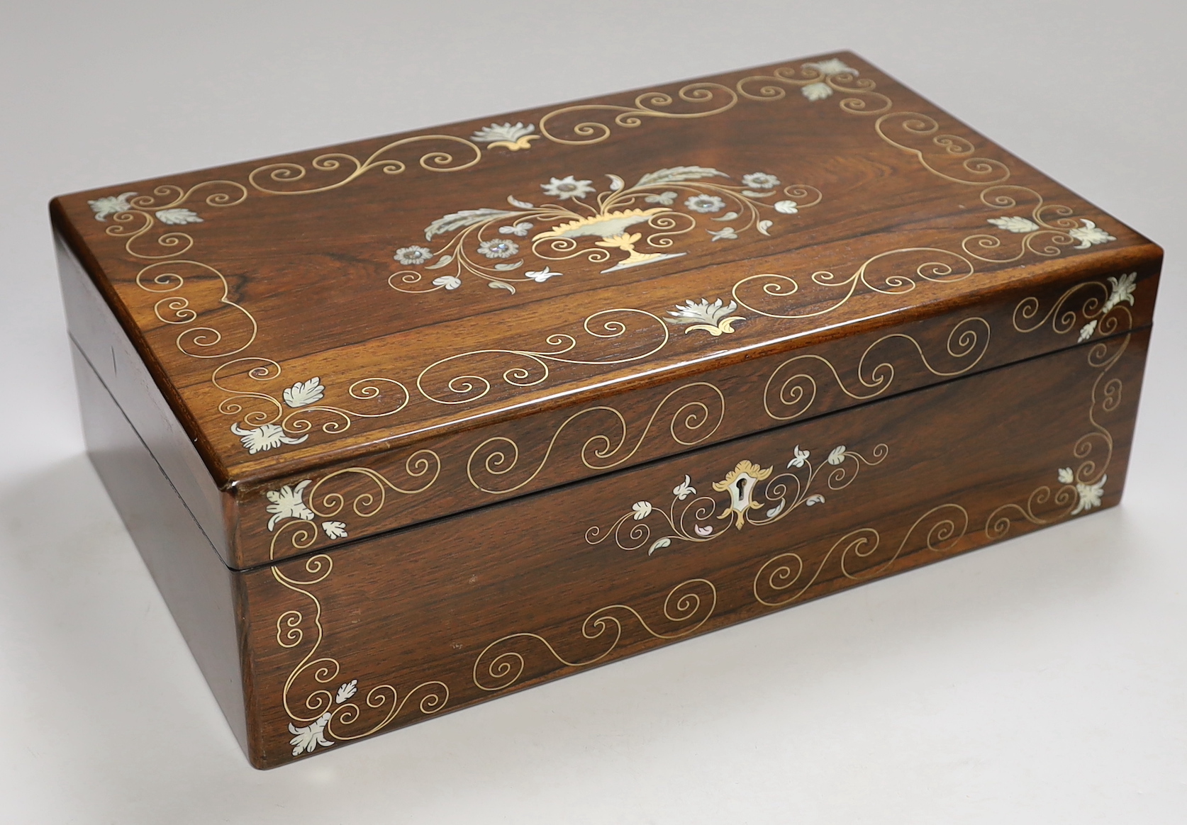 A 19th century brass and mother of pearl inlaid rosewood writing slope, 40cm wide                                                                                                                                           