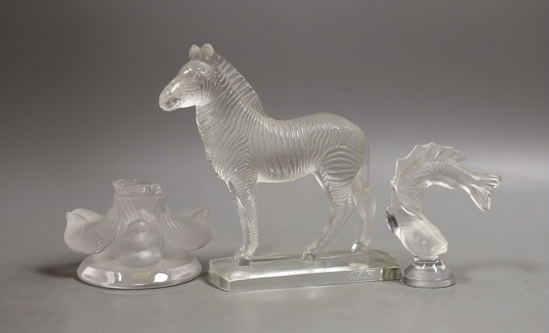 A Lalique glass fish paperweight, a Sabino glass zebra, 14 cm long and an incomplete Lalique base                                                                                                                           
