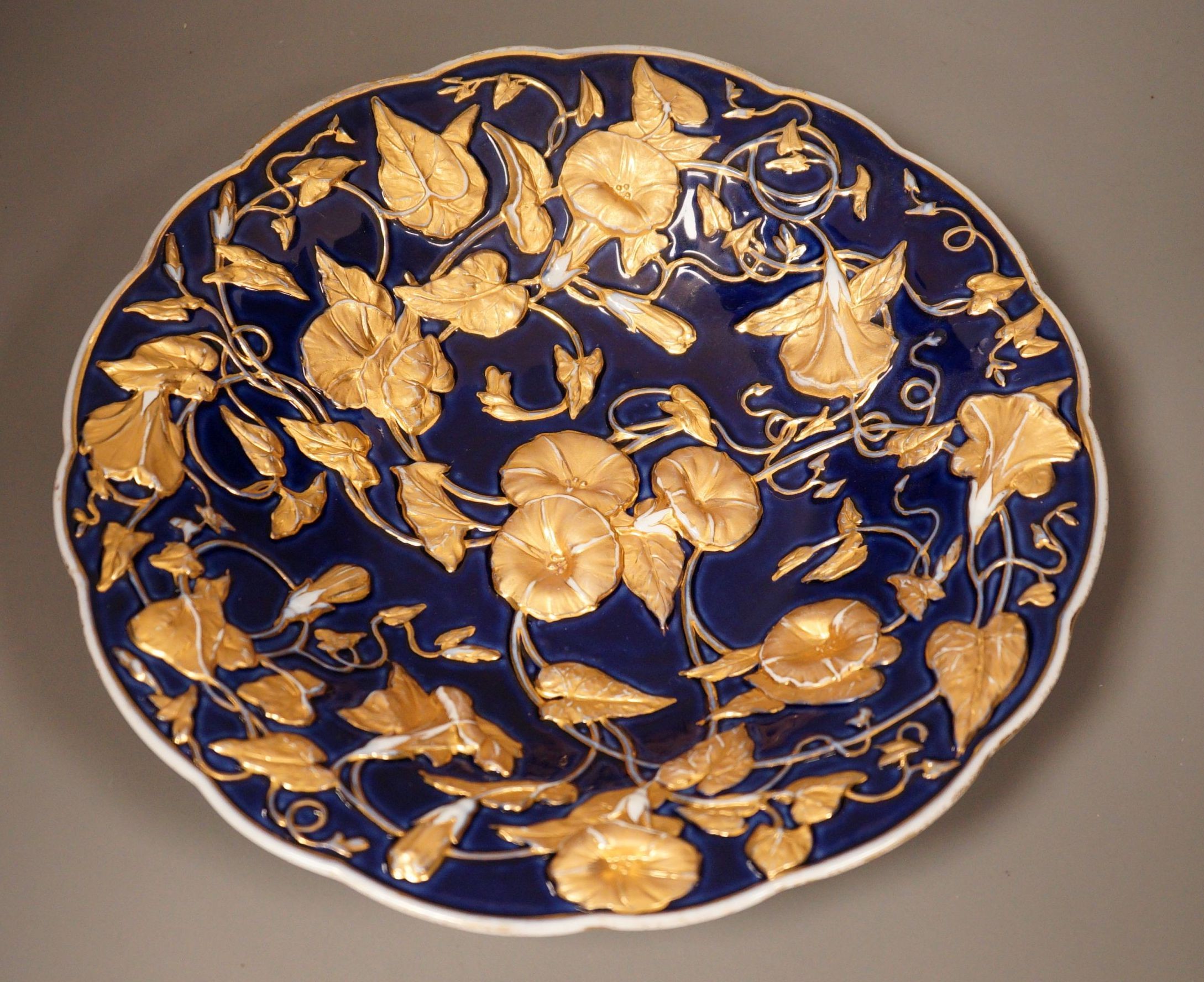 A late 19th century Meissen floral gilt and blue dish, 29cm                                                                                                                                                                 