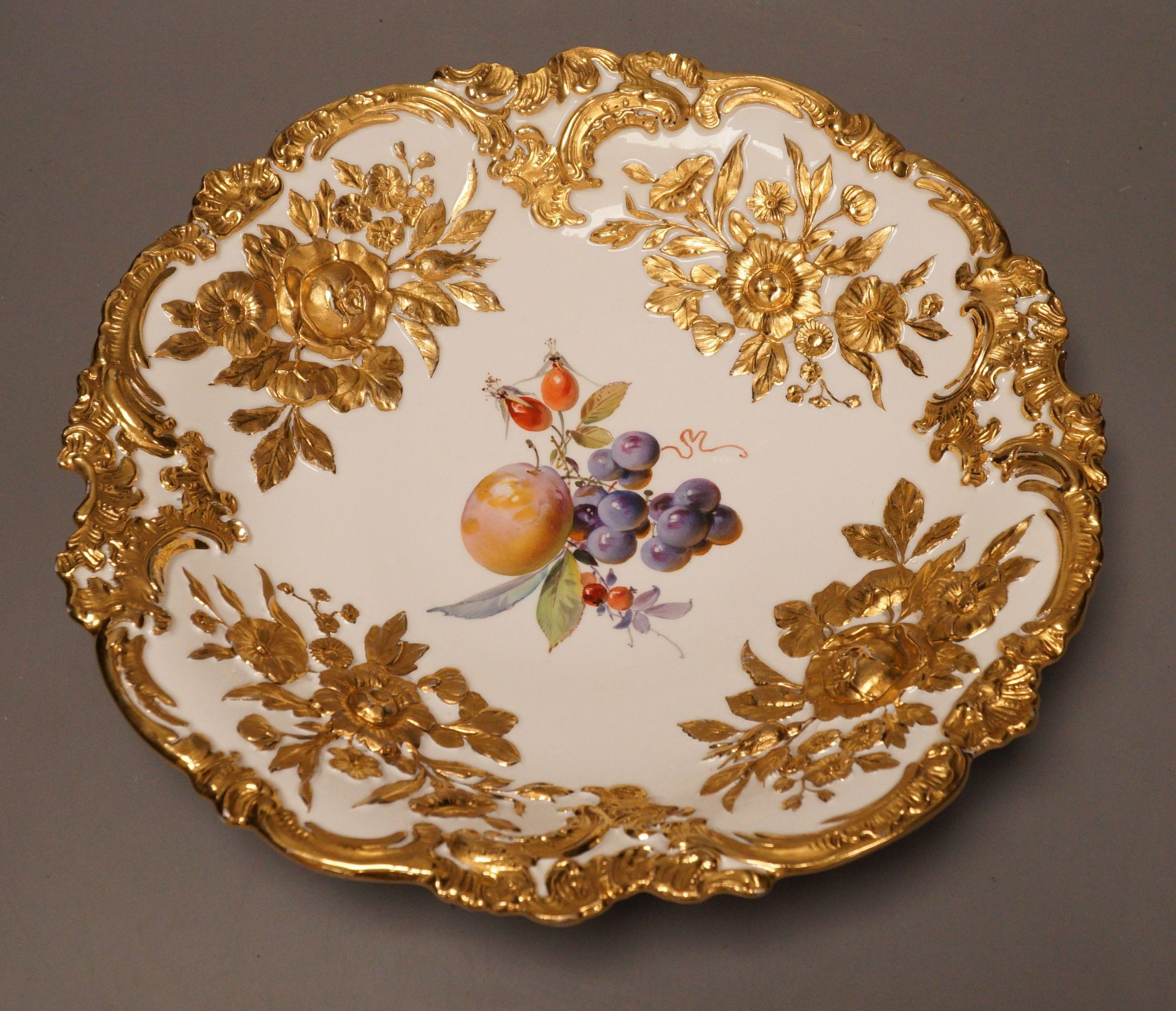 An early 20th century century Meissen fruit and floral gilt motif dish, 30cm diameter                                                                                                                                       
