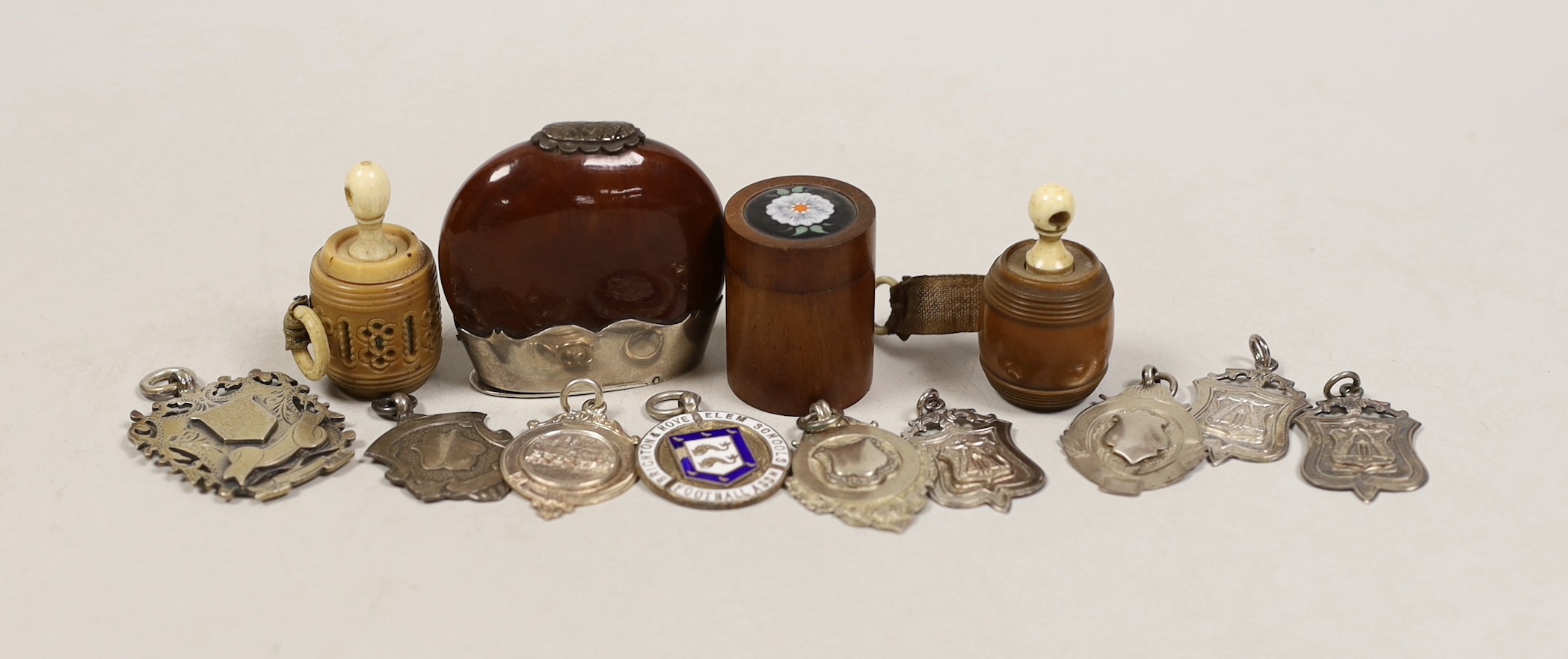 A ‘stag. silver’ mounted nut vesta case, two tape measures, a small box and sundry medallions                                                                                                                               