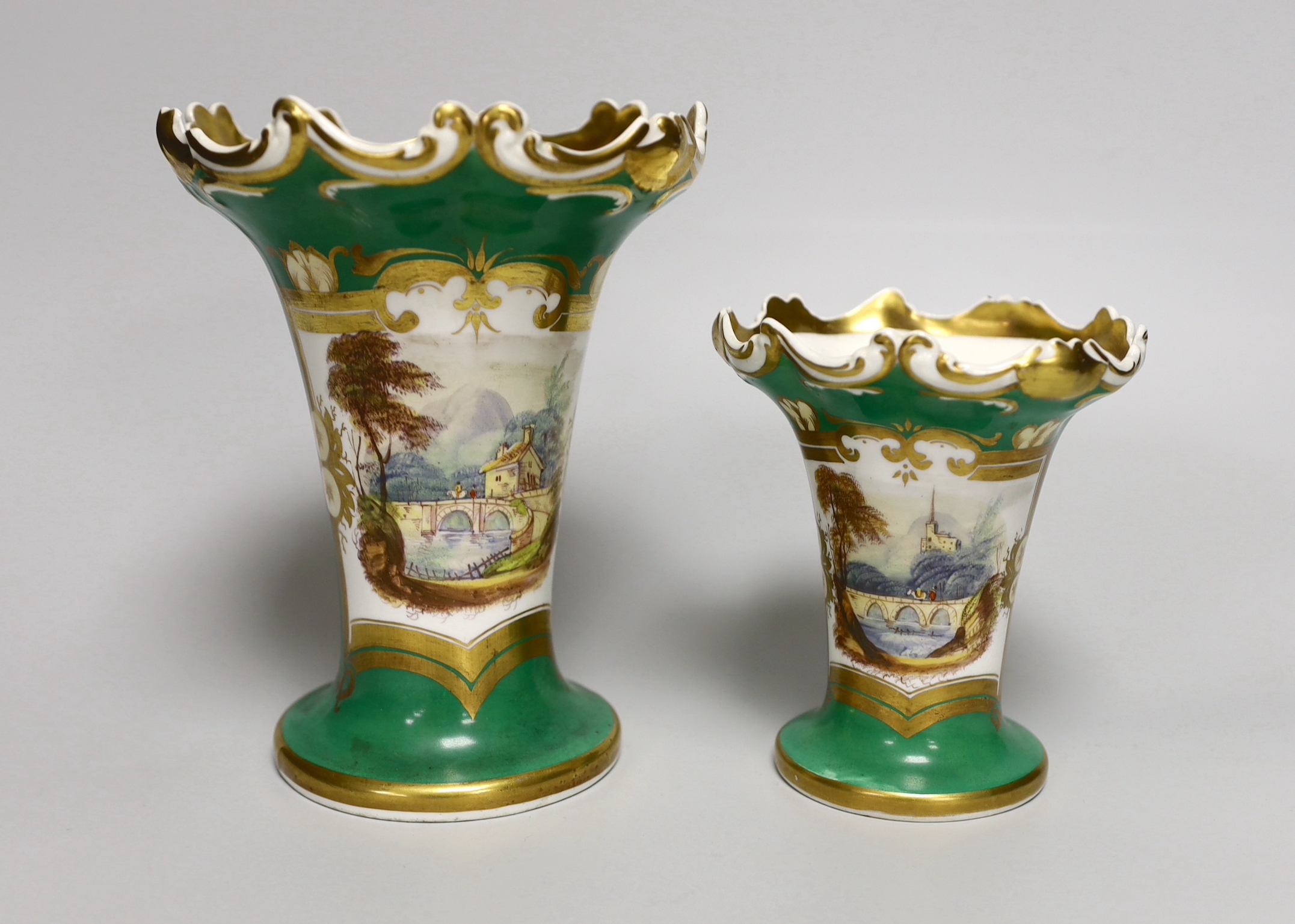 A pair of Rockingham type graduated vases with landscapes, tallest 17cm high                                                                                                                                                
