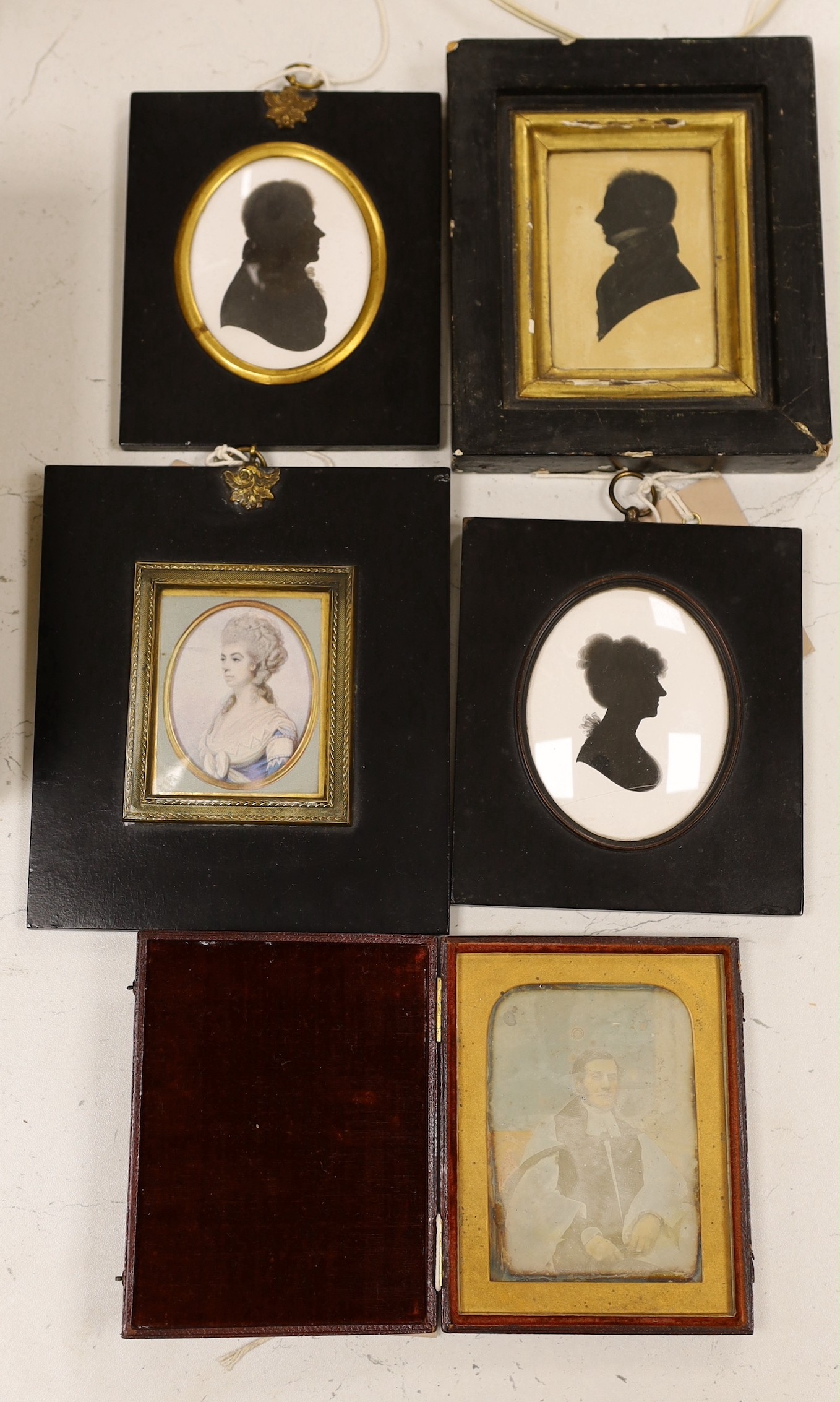 John Miers (1758-1821), painted silhouette of George Augustus Legge 1826, 8 x 6cm, two painted plaster silhouettes, a printed silk miniature and a daguerrotype (5)                                                         