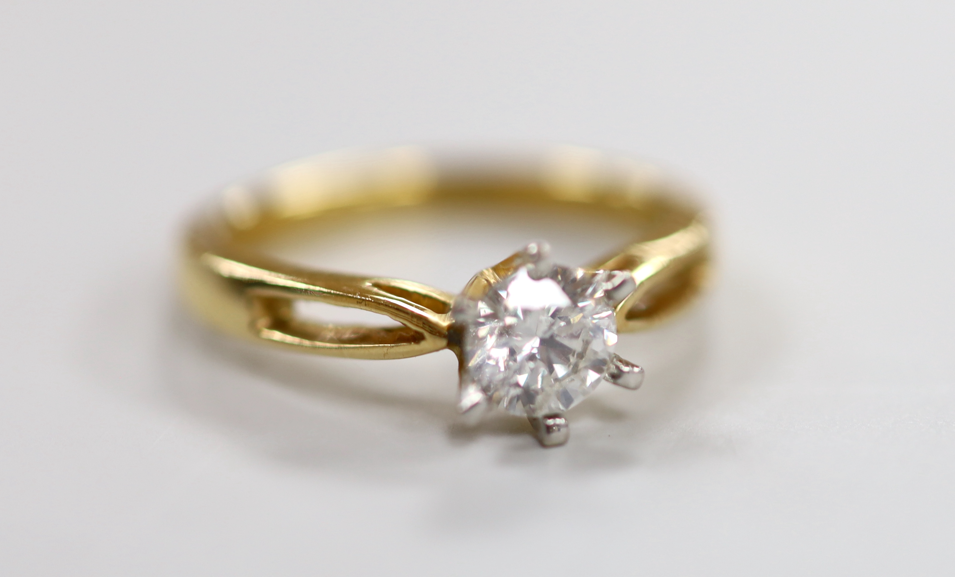 A yellow metal and solitaire diamond ring, size O, gross weight 4.2 grams                                                                                                                                                   