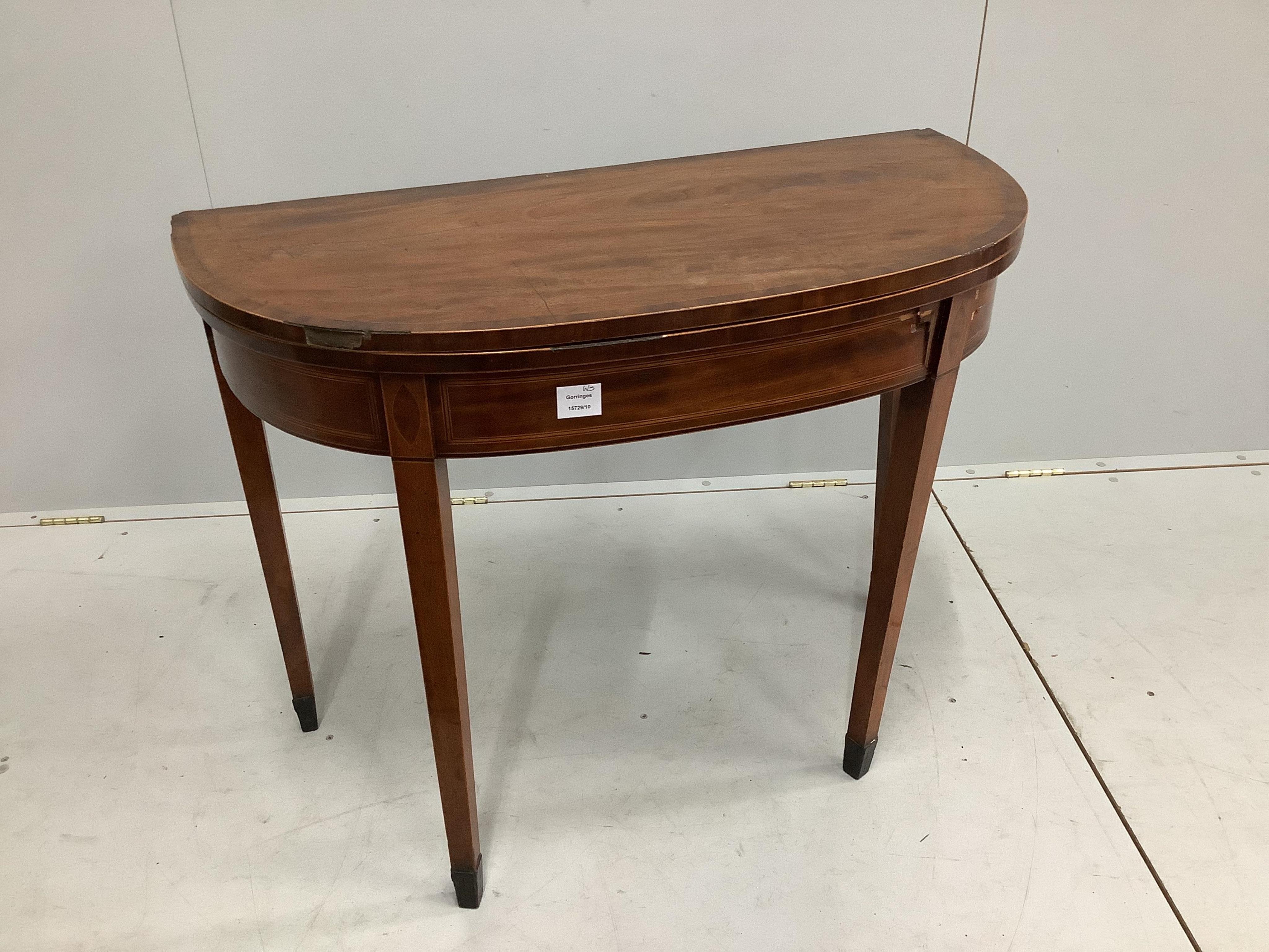 A George III inlaid mahogany tea table, width 92cm. Condition - poor                                                                                                                                                        